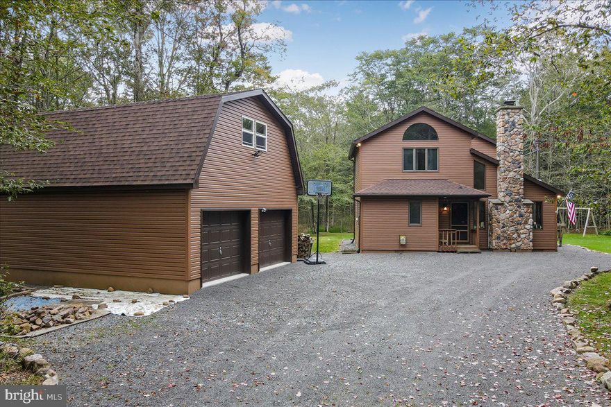 Spacious 3 Bedrooms 2 Full Bath Home on 3.77 Acres that backs up to the State Game lands. Huge 2 car, detached garage, with walk up second loft area. The Contemporary design features open design floorplan with wood burning Stone Fireplace and a wood stove. Lots of windows and natural light, with sliding doors out to a heated sunroom and large deck area. Deck and gravel patio area with firepit overlook surrounding wooded privacy. Main floor large master bedroom and full bath/laundry room. Upstairs has an Open loft for your extra guests, plus 2 additional bedrooms and full bathroom. Just minutes from Routes 380 and 80 in a smaller community of large acreage lots and low HOA dues. Ask how to receive a $3,000 lender credit towards closing costs or lowering your interest rate!