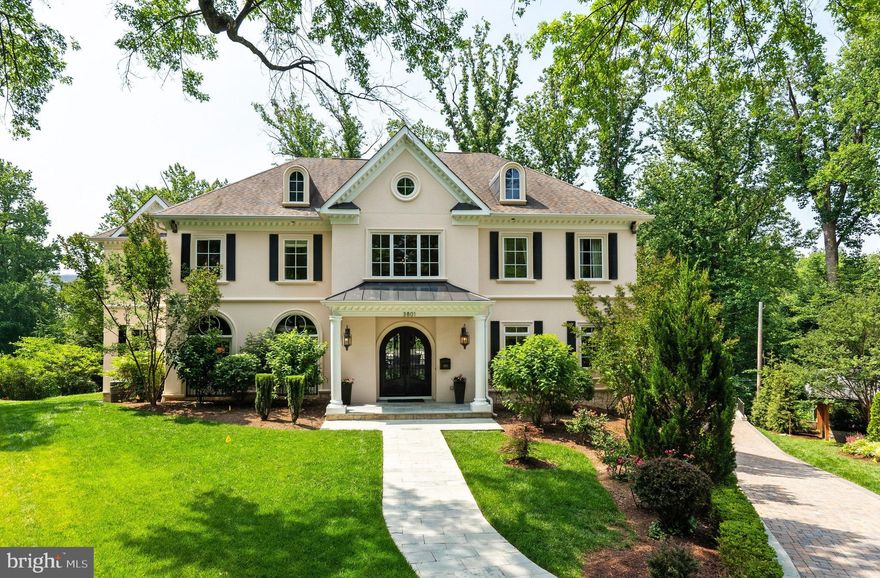 Exceptional Spring Valley estate offering tremendous interior scale with soaring high ceilings throughout approximately 9,150 SF of luxurious living space! This private sanctuary on a coveted cul-de-sac features 6 bedrooms, 6 full and 2 half baths, including an enormous primary suite with newly renovated spa-like bath and dual walk-in closets. The spectacular indoor-outdoor programming showcases an amazing newly installed swimming pool entertainment zone featuring travertine stone decking and perfectly positioned within mature specimen landscaping and impressive tree canopy creating a serene, resort-like setting. The thoughtfully designed side-loading 3-car garage with extended driveway accommodates 6+ vehicles total - a rare find in this prestigious neighborhood. Located in prime Spring Valley at the end of a private cul-de-sac, this remarkable property delivers the perfect balance of grand-scale entertaining and intimate retreat-style living just minutes from the area's finest amenities and conveniences! Only 0.6 miles to Millie's, Compass Coffee, Pizzeria Paradiso and all the shops in the Mass Ave commercial corridor.