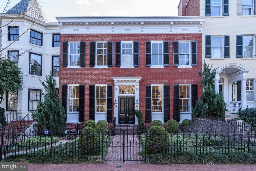 Spectacular 6BR/6.5BA in the heart of Georgetown's East Village w/ 7 CAR PARKING DECK, amazing yard w/ sport court, pool & pool house. This grand federal home features beautiful h/w floors, moldings, large entertaining rooms, & is flooded w/ light throughout. Lower level features kitchen, high ceilings, exercise room, rec room w/ built-in desks, and 2 offices leading out to the Garden and Pool.