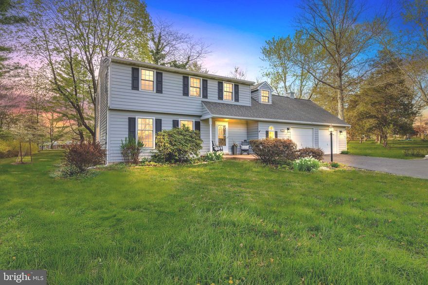 Welcome to 810 Lonely Rd, a beautifully maintained home situated on a full acre of land. This charming and lovely property features a traditional colonial layout with generous living spaces and tasteful updates throughout. Owners entering through the two-car garage directly into the house will love the oversized laundry room--perfect for leaving shoes and coats before heading inside. Guests will appreciate the long driveway, easy parking, and the warm welcome of the front door. Inside, the living room boasts a built-in banquet along the entire wall and opens to a dining room filled with natural light from windows overlooking the yard. The kitchen offers timeless cabinetry, granite countertops, tile flooring, and stainless steel appliances. There is a peninsula which offers even more counter space and a custom-built spot to gather for casual meals or your morning cup of coffee.  Entertaining is effortless with everything this sunny space offers with its expansive family room with a skylight, cozy wood-burning stove, and sliding doors leading to two decks and huge backyard. This level also includes a convenient powder room and access to unfinished basement. Upstairs, the primary bedroom is a true retreat, featuring a dream-come-true walk-in closet and a stunning ensuite bath with double vanities and a doorless walk-in shower accented by tumbled stone tile. Four (yes, four more!) additional bedrooms with closets share a beautifully updated full bathroom, complete with glass tile, double sinks, and a granite countertop. Enjoy the outdoors and privacy in every season in this truly bucolic setting,  ideal for your summer barbecues, game day parties, or simply stargazing around the fire pit no matter what the weather! At 810 Lonely Rd, you’ll feel a world away from the everyday hustle and bustle of daily life, yet remain just minutes from everything you need. Places like this do not come along everyday, and this one truly has it all, so hurry and schedule your tour today!