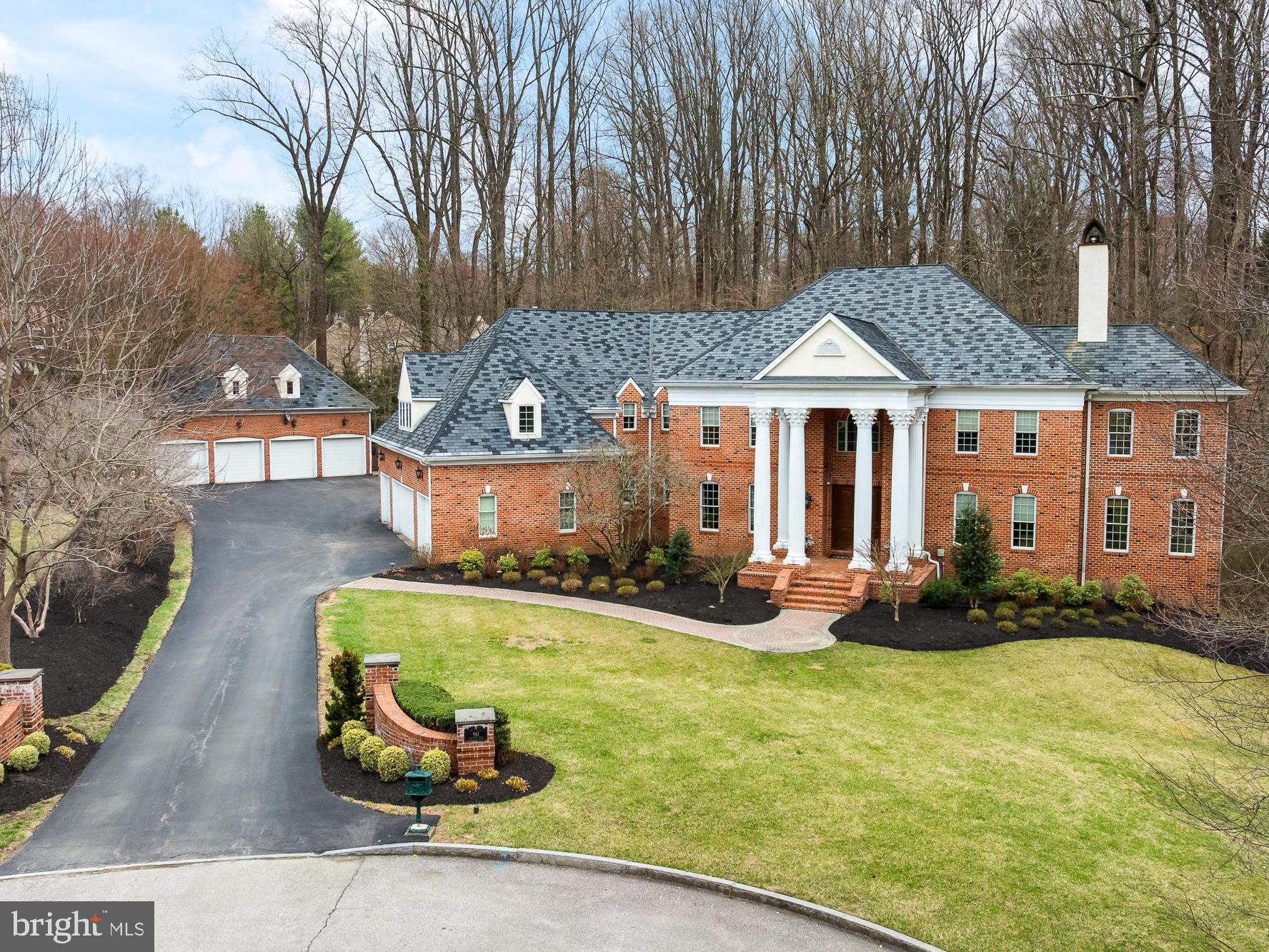 What if your getaway place was home? (TM) Experience life in the heart of the Main Line, where
you have convenient rail access to Center City and a high‐speed train to NYC just 5 minutes
away. The drive to Philadelphia International Airport is only 30 minutes. This property is located
in the award‐winning Radnor School District, with access to prestigious independent schools
and esteemed local universities. It also offers easy access to pharmaceutical, medical, and
financial centers.
Bryn Mawr is centrally located, providing excellent options for dining, exercising, local clubs,
sports facilities, and entertainment.
Nestled on 2 private acres—feeling more like 4 acres thanks to an additional 2 acres of open
space next door—this elegant Georgian Colonial home sits at the end of a cul‐de‐sac,
surrounded by beautifully styled residences. It boasts numerous unexpected features that
enhance its sophistication.
Upon entering this custom Dulgerian home, you are greeted by soaring columns and a sweeping
staircase that frames the grand foyer. The foyer offers a glimpse into the formal rooms. To the
left, the elegant dining room can accommodate twenty guests, while across the hall, the
exquisite living room captivates with its limestone‐carved fireplace. Just beyond the living room,
a warm and bright sunroom filled with greenery awaits.
At the heart of the home, an open floor plan connects all the main rooms. A great room, with a
wall of windows bringing in the natural landscape and a welcoming wood‐burning fireplace,
flows seamlessly into the chef's kitchen. This modern kitchen features light cabinetry,
professional‐grade stainless appliances, island seating, a butler's pantry, a walk‐in pantry, a wet
bar, and a breakfast room, making it the perfect space for entertaining.
A thoughtfully designed library, discreetly located behind the great room, offers a fireplace and
handsome cherry built‐in cabinetry, providing a tranquil workplace with picturesque wooded
views.
On the upper floor, the main suite serves as a wonderful retreat. It features a spacious bedroom
with a coffered ceiling, a fireplace, and plantation shutters. An adjacent sitting room boasts
spectacular views and is ideal for use as a gym or a second office. The spa‐like bathroom
includes a double shower, a large bathtub, an expansive vanity with double sinks, and
impressive cabinetry. Additionally, there are two walk‐in closets with built‐ins. On the other side
of the upper floor are two lovely bedrooms that share a Jack and Jill bathroom with double
sinks. Across the hall is an en‐suite bedroom with a private bathroom that has a shower and
vanity with double sinks. A tremendous in‐law or au‐pair suite with a generous private bath,
walk‐in closet, second closet, and a grand sitting area.
A spacious laundry room, conveniently located on this floor, provides access to the attic.
The lower level of the home serves as a walkout, extending across the entire floor plate and
featuring beautiful views of the woods and stream. It includes a large recreation room finished
with wainscotting, providing ample space for play and relaxation. Additionally, there is a wine
room (which could also serve as a safe room), a full bathroom, and a spacious storage area.
For car enthusiasts, this home is a dream come true, featuring four attached garage spaces.
There is also a detached two‐story garage that offers an additional four garage bays, along with
a finished room above and a powder room.