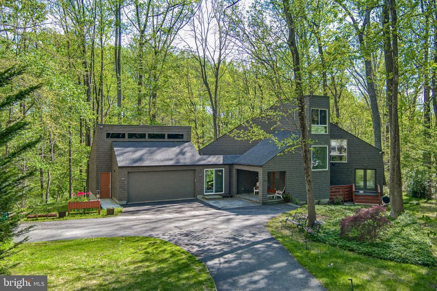 I am so honored to present this extraordinary property! It is a Classic Columbia Contemporary, that has been completely updated. The architecture is so thoughtful -- It is dramatic and elegant, but also warm and easy to live in. The sellers added a wonderful addition that comprises an entry room with storage, and a lovely bridge-breezeway to a two car garage with built-in EV chargers. They renovated most of the spaces top to bottom, replacing the kitchen, bathrooms, and installing warm cherry wood floors and smart lighting throughout. It offers sleek architectural lines and large windows that flood the interior with natural light. Nestled on a .46 acre lot backing to open space, there are gorgeous views from every window. The open-concept layout creates a spacious feel, but the rooms are human sized, and made for living…don’t miss the adorable ladder from the family room to the loft bedroom/office upstairs! Backing to woods and open space, the home provides a tranquil retreat with scenic views and direct access to nature, making it ideal for those seeking privacy and a connection to the outdoors. The Columbia open space path enters the woods from this cul-de-sac, and eventually leads to the Middle Patuxent River, and Environmental Area. It’s truly a woodland retreat in the middle of Columbia. Watch the deer, foxes, and birds play from one of your decks, then head to downtown Columbia less than three miles way for dining and shopping. Please also note the backup generator