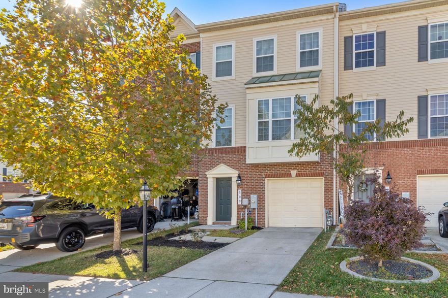 Immerse yourself into an amenity rich community of Tanyard Springs! Enjoy coming home to your Everything's Included Cambridge model townhouse built by Lennar Homes that has all the bells and whistles! This interior unit features timeless partial brick facade finished by a low maintenance vinyl siding.  Elevation 3B provides a bay window with a 2-foot extension.  Upon walking in, you will find yourself in the above grade "basement" that features a 19x14 recreation room, a coat closet and a powder room.  Main level boasts 9-foot ceilings, a 10x20 kitchen with an extended island and a breakfast bar, spacious dining room, walk-in pantry and a completely open layout.  This model has the powder room at the landing, completely away from all living spaces.  On the 3rd level, one can find the master suite and two secondary bedrooms. Master bedroom features 14x13 space, that can easily fit a king-size bed, a walk-in closet, and a bathroom with a dual vanity, shower with a bench, as well as a water closet.  Laundry closet is on the bedroom level. Deck off the kitchen.   Make active living second nature with distinctive amenities that blend the indoors and the outdoors, balancing the low key with the upbeat.  Amenities include: 24 hr fitness center, outdoor pool, splash pad, 3 dog parks, 4 playgrounds, community garden center, two picnic areas, over 3 miles of walking trails and much more. Conveniently located between Baltimore, Annapolis and Washington, DC.  Minutes away from Coast Guard, Amazon warehouse and about 20 minutes away from Fort Meade.