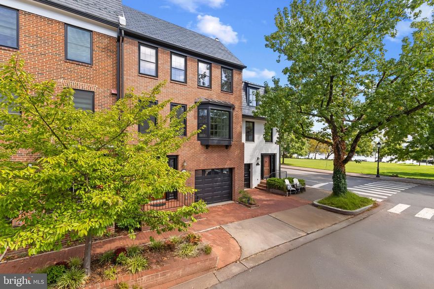 Experience the best of Old Town living in this beautifully renovated four-bedroom, three-and-a-half-bath residence, featuring a dramatic living room with 12-foot ceilings, a spacious dining room, lower-level recreation room, and upper-level office—all just steps from the Potomac River, Founders Park, scenic walking trails, and the vibrant shops and restaurants of King Street.

With no HOA or condo fees and the potential for a rooftop terrace showcasing jaw-dropping panoramic views of the Potomac River, the Capitol, and the Washington skyline, this home offers a truly unmatched combination of views, space, and location.

Enjoy two-car parking (garage plus driveway), a private flagstone patio surrounded by mature trees and a tranquil fountain, and spacious interiors designed for both effortless entertaining and easy “lock-and-leave” living.

Inside, a marble foyer with wide entry leads to a dramatic living room highlighted by a wood-burning fireplace and antique mantel. The sun-filled dining room with bay window flows seamlessly into a renovated chef’s kitchen with center island, while the family room offers a comfortable setting for relaxing or hosting guests.

The primary suite provides a serene retreat with a walk-in closet and spa-inspired bath. Two additional bedrooms share a stylish full bath, and the top-level suite includes another full bath, generous storage, and access to the future rooftop terrace with breathtaking city and river views.

As one of the largest homes in its coveted enclave, this residence combines timeless architecture with modern luxury—all within walking distance of the waterfront, city dock, and everything that makes Old Town Alexandria one of the region’s most desirable places to live.