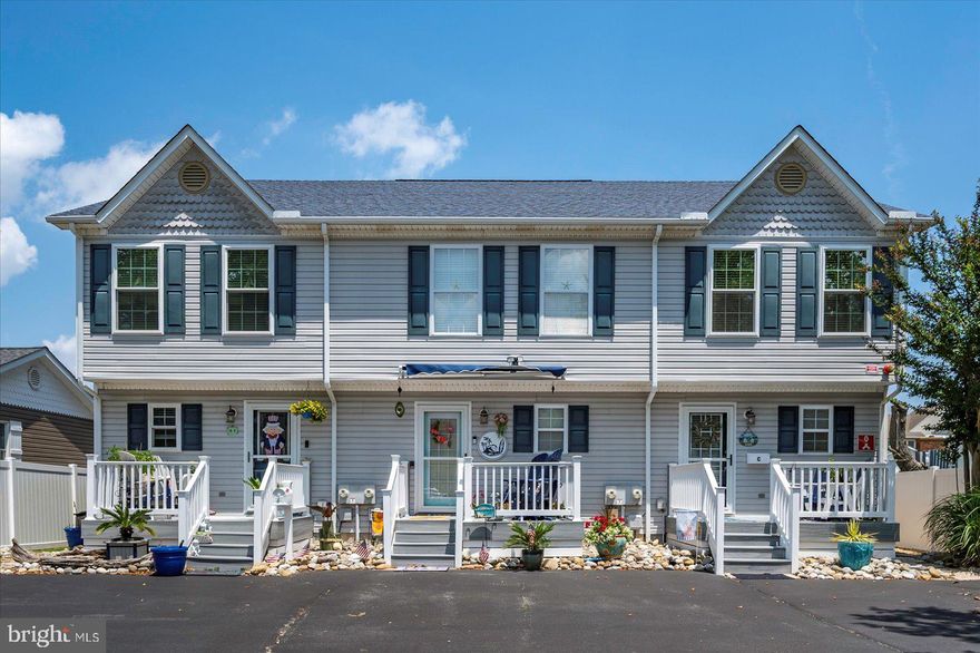 This turn-key townhouse retreat is perfectly situated in a quiet uptown location on a peaceful canal, complete with a private boat lift right out back—ideal for boaters and water lovers. Enjoy your morning coffee on the cozy front porch or unwind on the back porch overlooking the canal. Inside, you’ll find a warm, coastal-inspired interior with an open layout that feels instantly like home. A half-bath on the first floor for convenience.  Lovingly maintained and move-in ready, this home is perfect as a weekend getaway or a year-round residence. Just minutes from the beach, dining, shopping, and all that the best 94th st has to offer! Enjoy this vibrant coastal town yet tucked away for peace and privacy.  Salt Spray offers the perfect blend of comfort, convenience, and coastal charm.