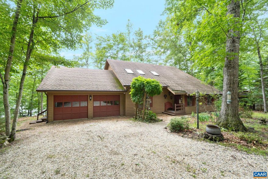 Waterfront Home in Amenity-Rich Golf Course Community! Live the lakefront lifestyle in this 4-bedroom, 4-bath home offering panoramic water views and a gentle walk to the shoreline. Set on nearly half an acre in a private, sought-after community, this home features two primary suites?including one on the main level?making it ideal for multi-generational living or hosting guests. The cozy entryway and beautiful vaulted formal dining room welcome you in, while the spacious eat-in kitchen flows seamlessly into the living areas and out onto a multi-tier deck, perfect for relaxing or entertaining with the lake as your backdrop. Upstairs, a family room and balcony offer even more stunning water views and flexible living space. Beyond the home, enjoy world-class community amenities including five sandy beaches, resort stye pool, basketball, tennis, golf, dining and more. With a two car garage and privacy this is more than a home it's a destination.,White Cabinets