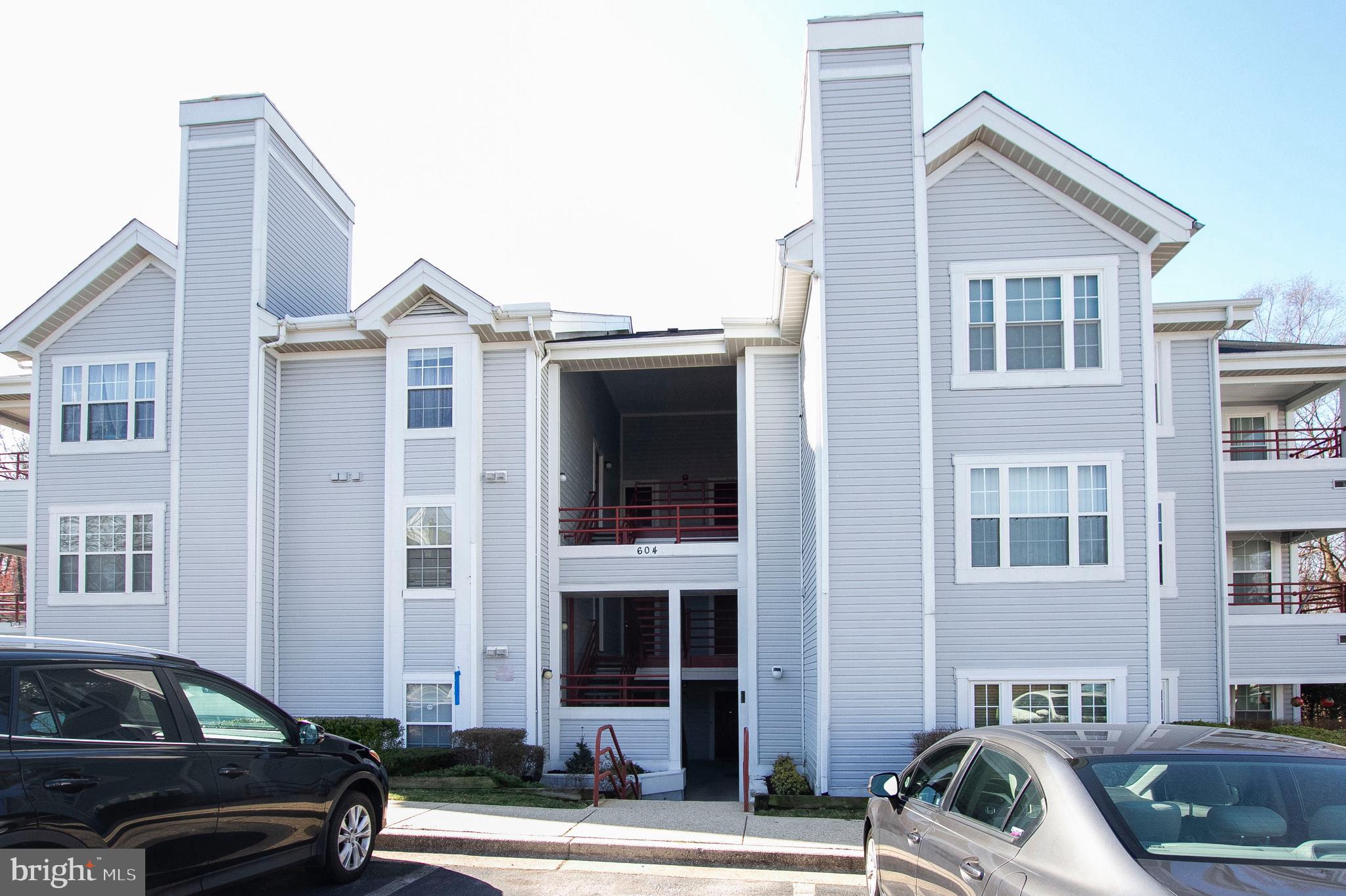 Move right in this gorgeous condo! Open concept floor plan featuring new wood floors & freshly painted throughout. Living room with wood fireplace. Enjoy sun room/den area off living room for extra living space. Kitchen has pass through to dining room for easy access. Master bedroom with 2 closets and sliders to private balcony. Well maintained community with playground, picnic area and a dog park! Conveniently located to shopping, schools, major highways & Ft. Meade.