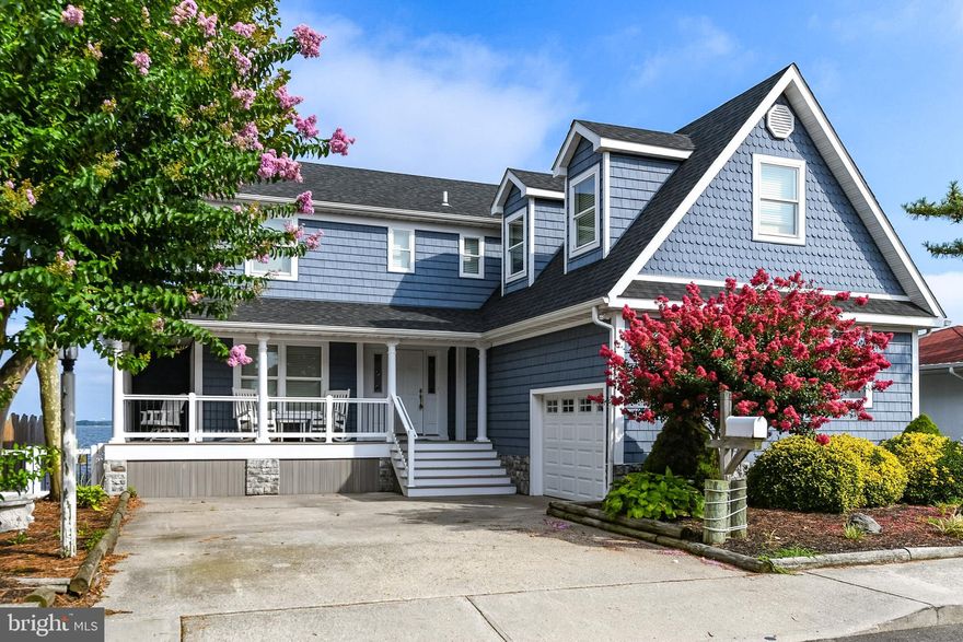 Ultimate Bayfront Dream Home. Major Upgrades through out  in 2018. 2 Boat Lifts. Gas Fireplace. Gas heating on first floor and Heat Pump on the second floor. Additional Bedroom  above Garage with Separate Bath.  Upgraded Vinyl Floors Throughout, except in bedrooms which has plush carpet. New Bulkheading installed in 2018.   Out side storage for your boating equipment. Watch the Fireworks Display at North Side Park from your private deck.