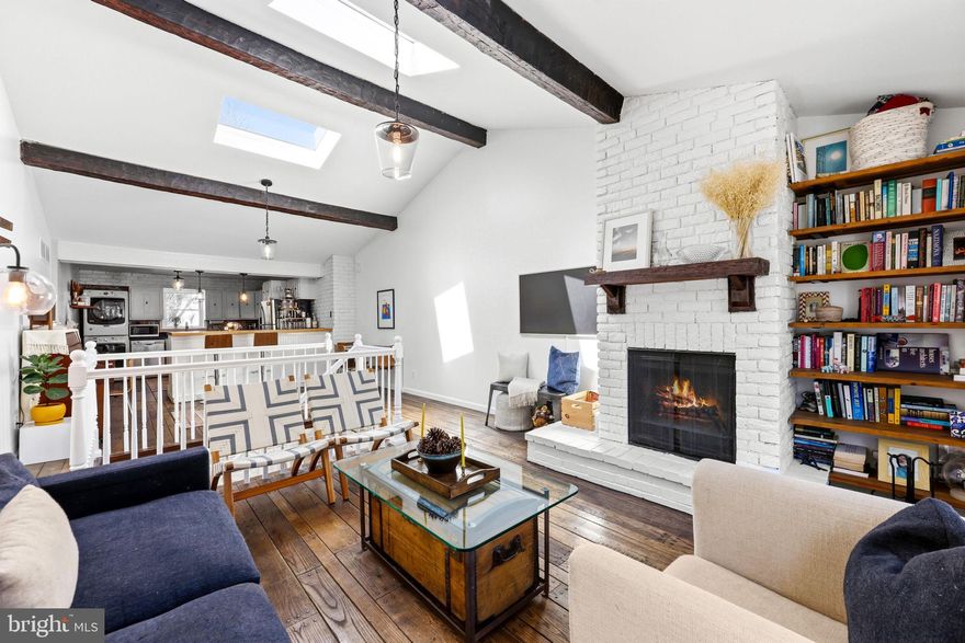 If you've ever dreamed of a cozy treehouse or cabin tucked into the city, 30 S. Durham Street is the one you've been waiting for! This charming end-of-group rowhome offers a rare city convenience - a deeded parking space directly in front of the home, large enough to comfortably fit a full-size SUV or even two smaller vehicles. Inside, the home features a unique and flexible two-bedroom, one-bath layout. The front bedroom welcomes you upon entry and works perfectly as a guest room, home office, or creative space. Down the hall is a full bathroom and a second bedroom with direct access to the private patio, creating a peaceful outdoor retreat. A separate door across from the bathroom leads to the exterior sally-port, offering additional privacy and flexibility for guests, roommates, or rental potential. Upstairs is where the home truly shines. Soaring lofted ceilings with beautiful exposed wood beams and recently installed skylights fill the space with natural light. The open-concept kitchen, dining, and living area feels warm and inviting, centered around a wood-burning fireplace that actually works - a rare and cozy feature that enhances the home's cabin-like charm. With its architectural character, end-unit privacy, outdoor space, and rare deeded parking, this home feels like your own peaceful retreat in the heart of the city. Located in the desirable Upper Fells / Butchers Hill neighborhood and just minutes from Johns Hopkins Hospital, this home is also eligible for the Live Near Your Work (LNYW) grant program, offering both lifestyle and opportunity in one unique package. Schedule your private tour today!  **OFFER DEADLINE: Please submit offers by 2pm on Tuesday, March 17th. **