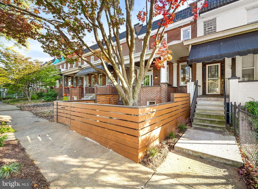 Nestled on a peaceful, tree-lined block, 855 W 33rd Street is a masterfully renovated home that was taken down to the studs and completely renovated in 2024. This 3-bedroom, 3.5-bath residence features all-new systems, water and sewer lines, thoughtfully added access points, plus more. Every detail has been crafted to maximize natural light, with skylights and glass doors creating an open, airy atmosphere throughout the home, a feature seldom found.

The main floor features a sleek, open-concept design that seamlessly blends style and function. The gourmet kitchen is outfitted with ample space, high-end Bosch and Viking appliances, custom cabinetry and molding. Flowing effortlessly into the bar and dining areas,  it’s perfect for everyday living and entertaining. The exposed brick wall and reclaimed wood flooring add warmth and character, melding modern aesthetics with classic Baltimore charm.

Upstairs boasts two bedrooms, each featuring en suite bathrooms with modern, on trend finishes. Skylights illuminate the upper level, enhancing the spacious and bring light-while ample closet space ensures convenience without sacrificing design.

The fully finished basement brings exceptional versatility, complete with a bedroom, full bath, and cabinetry with sink, making this level ideal for a guest or in-law suite, Airbnb rental, home office, or creative studio. With access from both the front and back, it expands the home’s livable space while offering practical solutions for a variety of needs.

Step outside to enjoy the inviting front porch or unwind on the back deck—perfect for morning coffee. The landscaped front and back yards feature garden beds, mature trees, and a grilling area. A paved section can double as an al fresco dining space or private parking pad, offering both flexibility and convenience.

Located just minutes from Hampden’s vibrant shops, restaurants, and parks, this home offers the perfect blend of modern living, historic charm, and prime location. Thoughtfully designed and move-in ready, this home is a true gem in one of Baltimore’s most desirable neighborhoods!