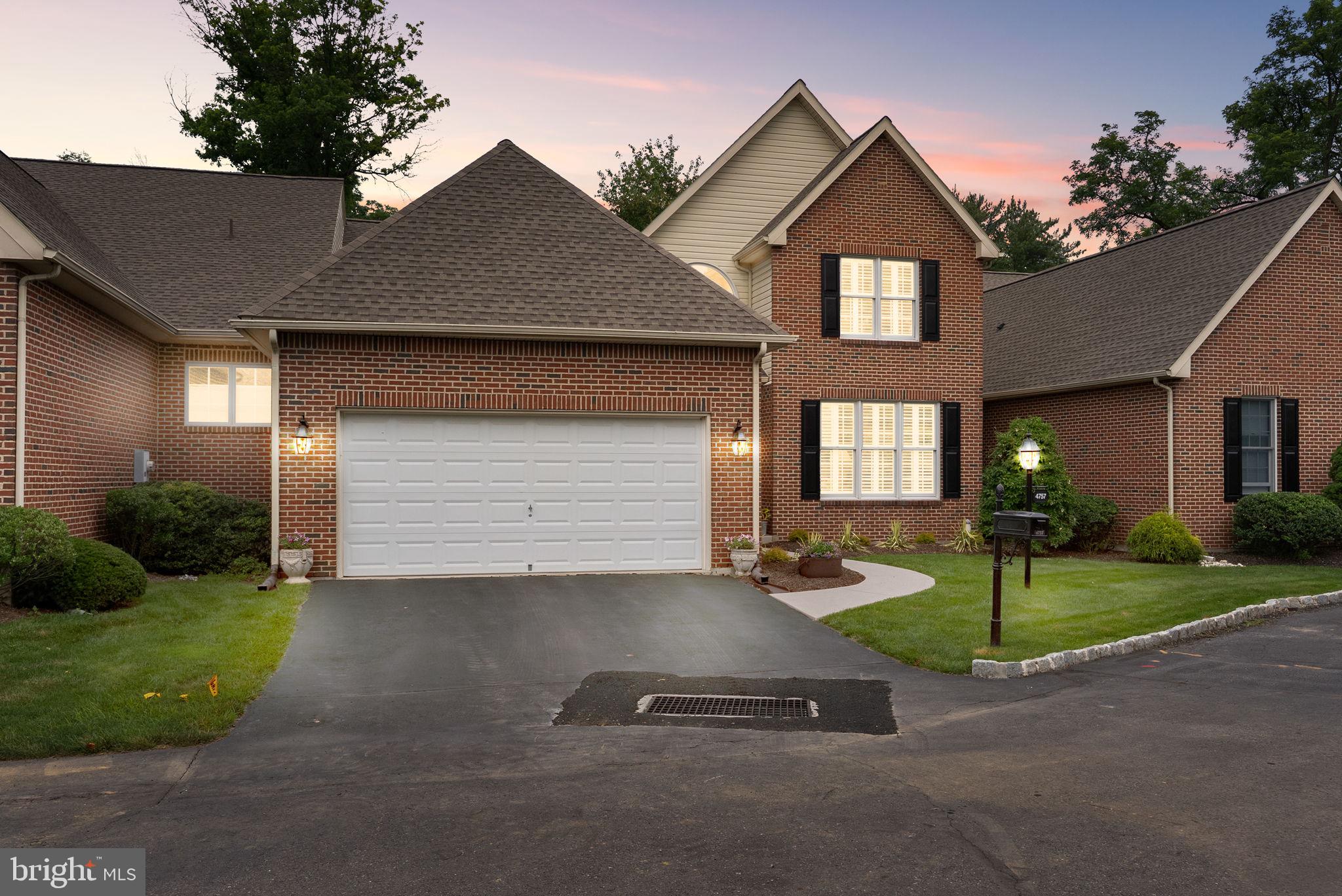 A downsizing dream, this gorgeous Woodcrest condo combines elegant design with convenient single-floor living and no exterior maintenance. No more snow shoveling or cutting grass or worrying about putting on a new roof or fixing the exterior of your home. It’s all covered by the HOA. The first-floor primary suite has vaulted ceilings, dual walk-in closets, and a spa-like bath with a large soaking tub and walk-in shower. A convenient first-floor laundry room and direct interior access to a spacious 2-car garage means accessibility is no longer an issue. Enjoy the elegant and durable hardwood and abundant natural light in the spectacular great room with soaring cathedral ceilings and floor-to-ceiling windows. The den/formal dining room features custom coffered ceilings, classic wainscoting, and exceptional acoustics—perfectly suited as a music or multipurpose room. The expansive kitchen has cherry cabinetry, modern countertops, updated backsplash, new stainless steel appliances, a spacious island, and a charming eat-in area. Relax on your low-maintenance Trex deck, ideal for morning coffee or evening gatherings. Upstairs is two generously sized bedrooms, a full bath, and a versatile office/theater room with a skylight to let in plenty of natural light. The dry basement offers endless possibilities: workshop, storage, home gym. A quiet community just minutes from Bethlehem, The Promenade Shops, top golf courses, in the Southern Lehigh School District, this home is exceptional.