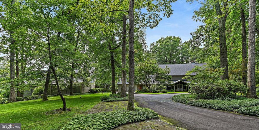 Rare opportunity to own a 13 acre gorgeous, very private property. Only 3 minutes from Great Falls Village.
Very unique custom built country home with contemporary accents. Three floors of living space with 5 bedrooms and 6 full baths. Windows are everywhere. Enjoy nature and beautiful views both outdoors and indoors. Land is under conservation easement and can't be subdivided.
**************
 Large kitchen-family room  with custom cabinetry, stone chimney gas fireplace, recessed lights & two table spaces. Three kitchen islands, natural gas stove, and multiple sinks. There are French doors to patios, a full wall of windows, a two story gable with cathedral window, and exposed rustic beams throughout. 
********************
Fantastic Great Room has floor to ceiling stone chimney front, exposed beams, 3 french doors and built-in library shelves. 
*********************
Attached indoor pool pavilion with walls of windows, exposed ceiling beams, and gabled ceiling with clerestory windows.
*********************
Attached concert/entertainment pavilion with gleaming hardwood floors, high ceiling with cathedral windows at both ends. Built as a concert hall and has fantastic acoustics.  A musician's delight!
Lower level is a huge workshop with room for a car lift and storage space for numerous cars.