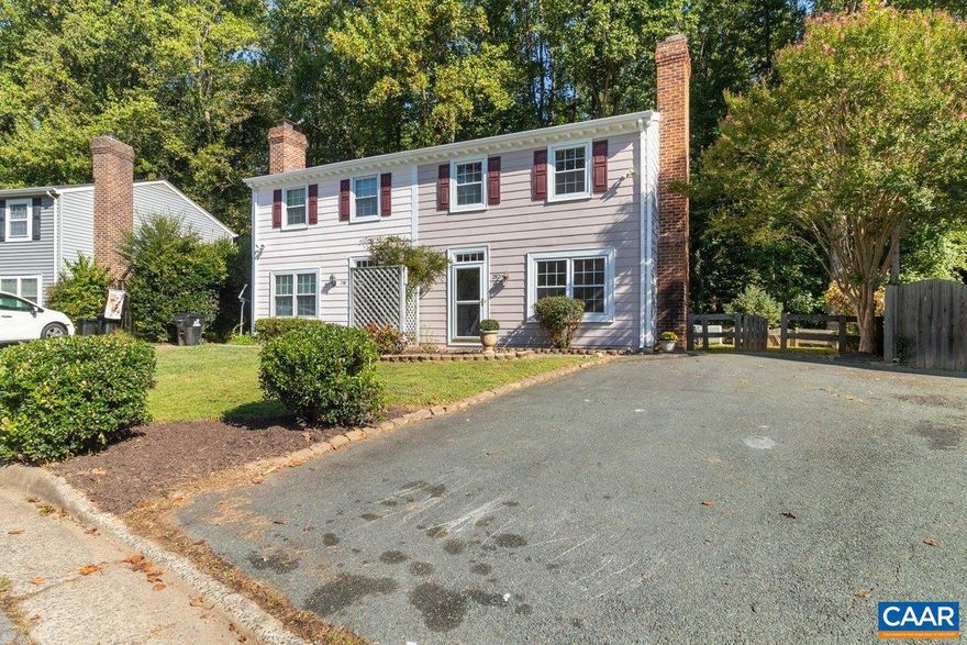 Great starter home or investment property with off street parking. Once you enter the home you are greeted by a formal living room with a wood burning fireplace and a separate dining room off of the kitchen. In the kitchen you have new cabinets (with under cabinet lighting) and a gorgeous new quartz countertop to complement the newly installed LVP flooring. A nice size laundry room with new LVP flooring that could double as extra storage space. Upstairs you will find new carpet leading into the large primary with 2 closets, two additional bedrooms and a full bath. Enjoy the 1.5 miles of walking trails from your backyard as this home backs up to Humphries Park, a 25-acre park. This home is an Ideal IN-TOWN location! Within minutes you could be at The Shops at Stonefield, Costco, Regal Cinemas, UVA or downtown. Did I mention that this home has been freshly painted, is move-in ready, sits back in the cul-de-sac and has no HOA?,Bus on City Route,Fireplace in Living Room