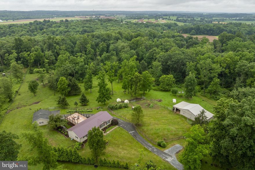 AUCTION DATE - MONDAY, AUGUST 18, 2025 AT 6PM. LISTED PRICE IS AN OPENING BID ONLY AND IS NOT INDICATIVE OF THE FINAL SALE PRICE. REAL ESTATE: Custom frame/vinyl rancher w/3030 SF finished area, eat-in kitchen w/custom cabinets, breakfast bar/island, pantry & appliances, (2) dining areas, living room w/bow window, 4 bedrooms (primary bedroom w/primary bath w/whirlpool tub), 3 full baths, laundry, full daylight basement w/superior walls, finished family/rec. room & utility room, wood stove heat, central AC, insulated Provia windows, all doors updated in 2023 & large rear deck 24x42. Outbuildings: Metal/frame barn 32x62 w/sliding door, equipment storage & stable area & detached frame/vinyl 2 car garage 24x30 w/electric all on partially wooded 10.3 ACRES w/fenced pasture, macadam driveway, mature shade, professional landscaping, on-site well & septic. NOTE: Ideally located acreage family property w/custom clean, well maintained rancher w/spacious rooms & move in condition. Convenient location, minutes to Mt. Gretna, Campbelltown & Elizabethtown w/easy access to Rts. 322, 117, 241, 743 & PA Turnpike. Terms 10% down, balance 60 days or before. Personal inspection by appointment or open house Sat., August 2, 9 & 16 from 1 to 4 PM.