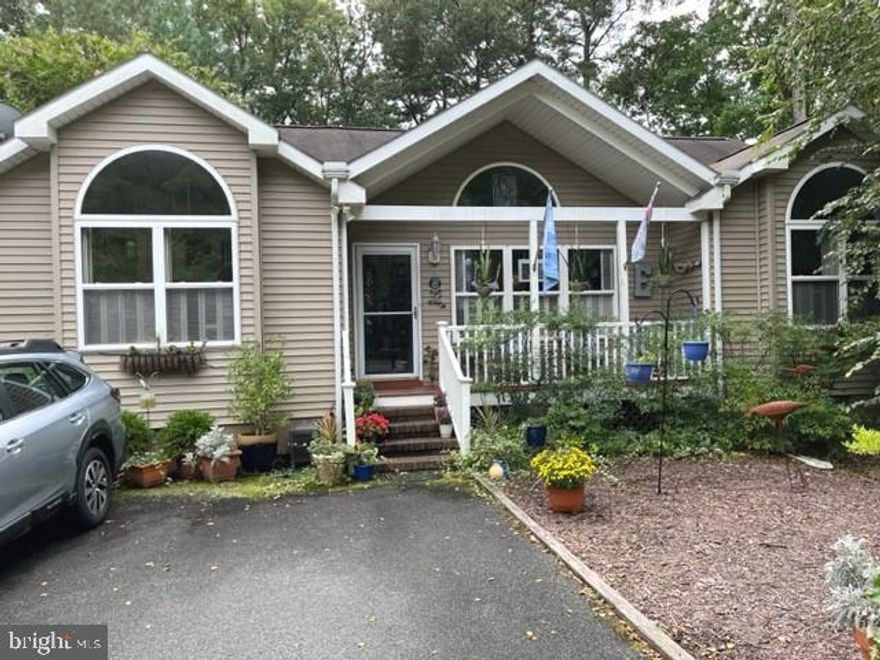 Single story with master bedroom and guest bedrooms separated by living and dining rooms each with private baths.   Florida room and deck overlooking landscaped back yard with a fish pond.  Quiet location near the end of Ocean Parkway and across the street from a wooded preserve.  NewHVAC system with 5 year warranty.