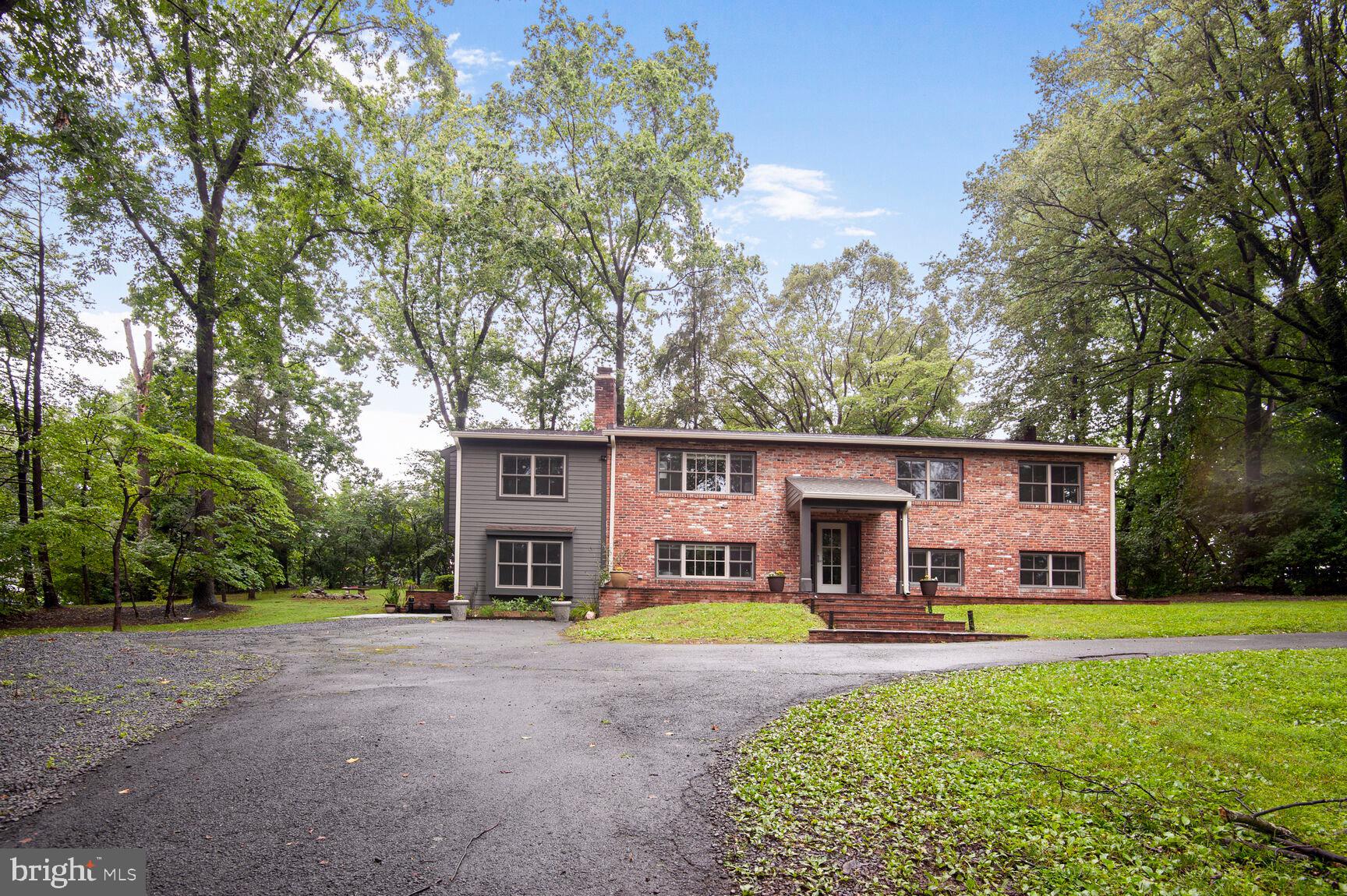 Have a look -- you won't be disappointed. Despite its conventional exterior appearance, this home has been updated with contemporary flair and sophisticated finishes and excellent workmanship by its artist-owner. Stunning gourmet kitchen with custom cabinetry and Silestone counters. High-end flooring, windows, doors, hardware, and trim. Wonderful great room with vaulted ceilings and fireplace. Cozy lower level family room / studio. Four bedrooms, including a spacious primary suite with huge closet and upgraded bath and adjacent study / home office. Big rear deck overlooking large back yard. With nearly one acre of land, this property enjoys excellent privacy. Circular drive with home set back far from the road. Outstanding location walkable to the center of Oakton, right behind Flint Hill School, with easy access to Metro, I-66 and 123.