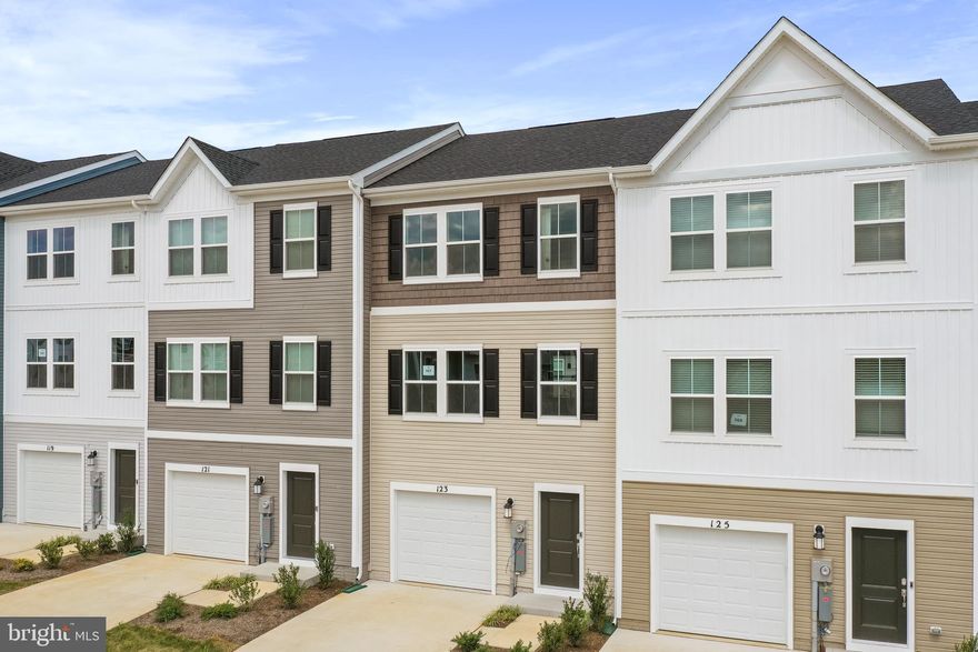 Welcome to The Gallery, one of Martinsburg’s newest communities! Conveniently located near shopping, dining, recreation, and just minutes from I-81, this beautiful end-unit townhome offers added privacy, extra natural light, and enhanced curb appeal.

Enter on the lower level where you’ll find a spacious recreation room — perfect for a home office, gym, or additional living space — along with access to the one-car garage and backyard.

The main level features an open-concept layout with a bright great room flowing into the dining area and kitchen. The kitchen includes stainless steel appliances and ample cabinet space. A convenient half bath is also located on this level, ideal for guests.

Upstairs on the upper level, you’ll find all three bedrooms, two full bathrooms, and the laundry area for added convenience. The primary suite offers a private full bath and generous closet space. Bedrooms two and three are well-sized and share a full hallway bathroom, making this level both functional and comfortable for everyday living.

✨ Homes in this desirable community rent quickly submit your application today and secure this beautiful home before it's gone!