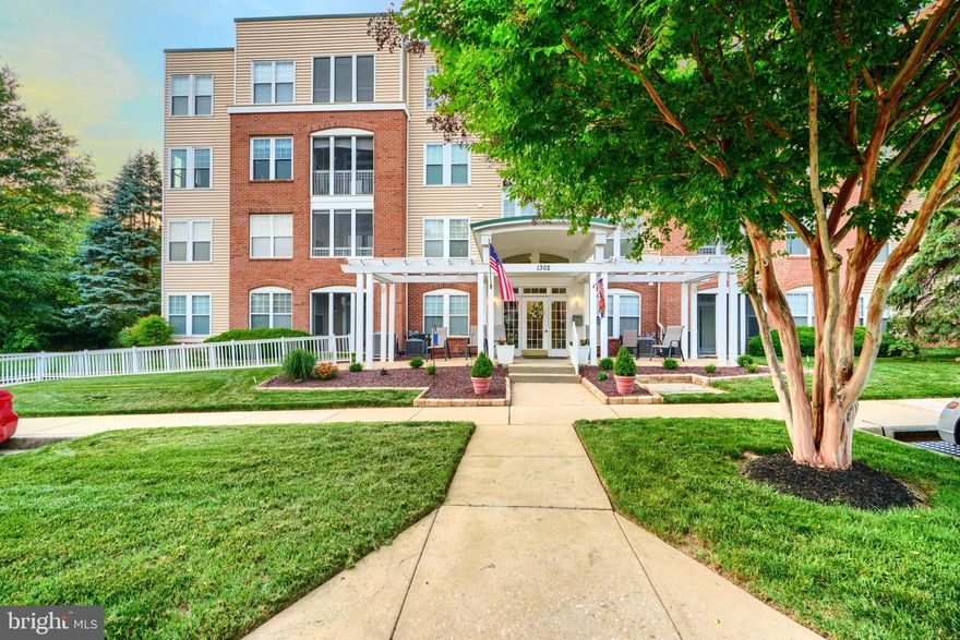 Welcome to 1302 E Scottsdale Drive, a spacious second-floor front unit located in the sought-after Greenhaven community in Bel Air. This elevator-accessible condominium is one of the largest in the neighborhood and offers a comfortable, open layout perfect for everyday living and entertaining. Inside, you'll find a welcoming foyer, a bright living room, a formal dining area, and a cozy family room with a gas fireplace. The eat-in kitchen features 42-inch cabinets, hardwood floors, and ample counter space. Nine-foot ceilings throughout add to the airy, open feel. Enjoy your morning coffee or unwind in the evenings on the screened-in balcony. The unit offers two generously sized bedrooms and two full baths. The primary suite includes a huge walk-in closet and a private en-suite bath. Greenhaven offers fantastic amenities including a community pool, fitness center, and meeting room. Conveniently located near shopping, dining, and major commuter routes—this is easy, low-maintenance living at its best!