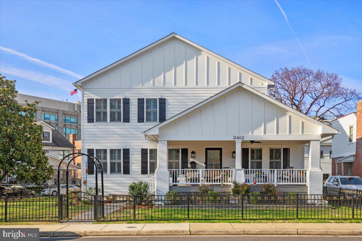 Constructed and delivered in November 2020 by design/build firm Morris Construction Company, this extraordinary Craftsman Style luxury home is in Arlington VA, within minutes of Washington D.C., Ronald Reagan Airport, Rt. 66 & Rt. 395, walking distance to Clarendon and Courthouse Metros, restaurants & shopping in the sought after Lyon Village neighborhood. With 3 fully finished levels of living space, the house has 6 bedrooms, 5 full baths and 1 half bath. The main level features 10-foot ceilings with crown molding, recessed lighting, Sonos built-in sound system, oak hardwood floors, and plantation shutters on all windows. Gourmet style, stainless steel and quartz kitchen featuring a 12' x 8' breakfast nook and a 7' x 4' center island with built-in storage. A Sub-Zero Refrigerator, 6 Burner G.E. Cafe Series Brushed Bronze Range, G.E. Profile Advantium Built-In Microwave/oven, Bosch Super Silence Dishwasher, Whirlpool Beverage Center, and Asko 24" Washer/Dryer accent the kitchen. Also located on the main level are the dining/living room, study/office, spacious family room with built-in gas fireplace.
The first floor also has a bedroom with an ensuite, mudroom with built-in shelving, and a half bath. The incredible upper-level features oak hardwood floors, recessed lighting, plantation shutters on all windows, 4 bedrooms with 3 full baths; the primary suite features a large separate shower, double sinks and a large walk-in closet with built-in shelves and dresser. There is also a separate second floor laundry room with a built-in folding table, shelves, and a Maytag 27' washer/dryer. The lower-level features its own separate entrance, in-law/nanny bedroom with full bath, recreation room and a storage/utility room with built-in shelving. There is a large outdoor tool shed, off street parking for 3 cars, an amazing 26' x 8' covered front porch, and an outdoor gas grill hook-up. This property is situated on a completely fenced in lot with four easy access gates, paver driveway and a beautifully landscaped 7,943 sq ft corner lot.