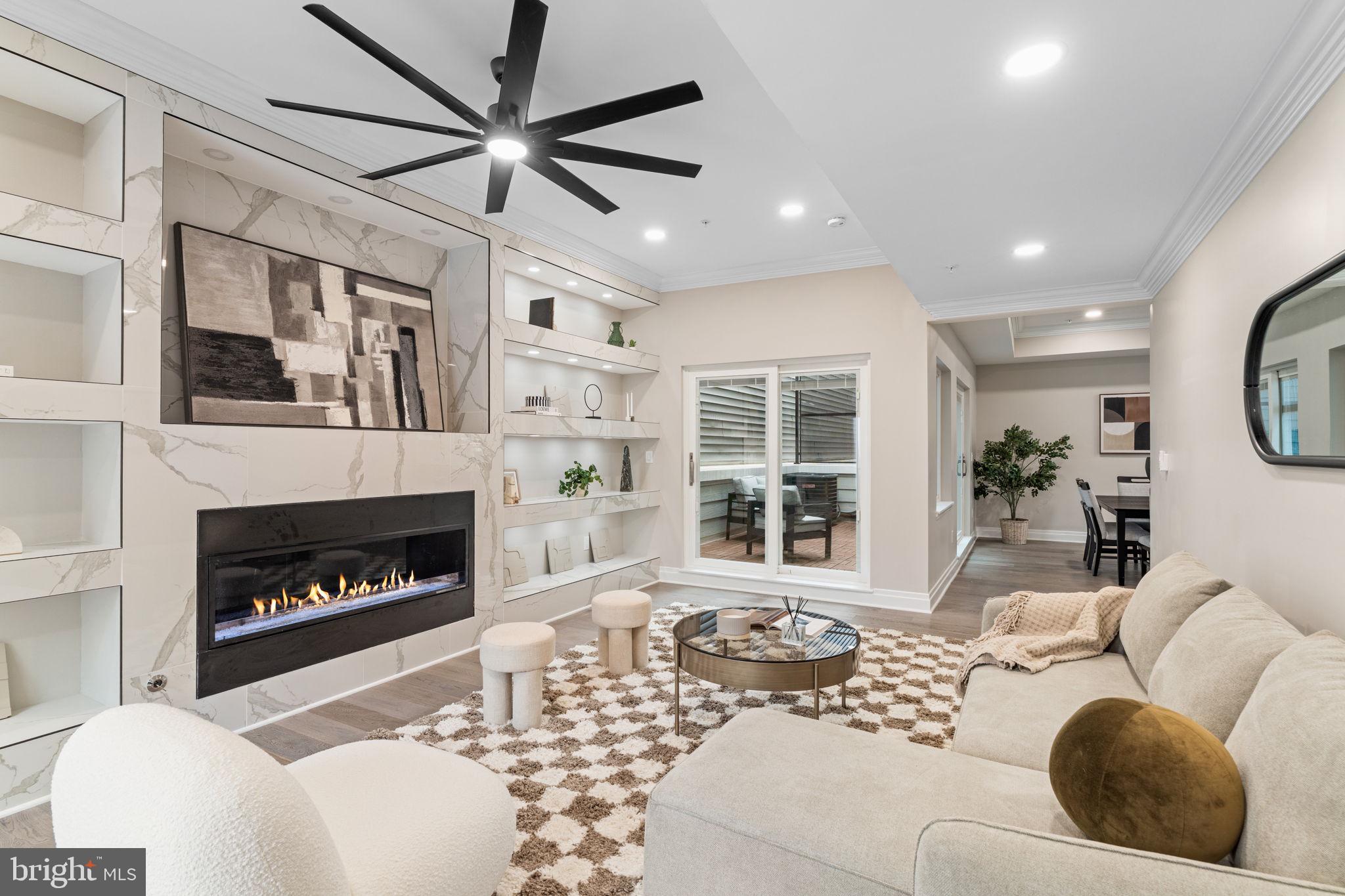 Welcome to The Estates at Queen Village, a rare opportunity to own a newly constructed, meticulously crafted luxury townhome in one of Philadelphia’s most sought-after and culturally rich neighborhoods. 10 Year Tax Abatement and multiple outdoor spaces! Surrounded by tree-lined streets, award-winning restaurants, cafés, and historic architecture, this 4,000+ sq. ft. stunner delivers the ultimate blend of city living, modern design, and suburban-life style spaces. Every inch of this 5-bedroom, 5.5-bath residence has been thoughtfully designed to elevate daily living. From the moment you arrive, the vibe is unmatched, beginning with a private, heated two-car garage featuring epoxy-finished floors, EV pre-wiring, and double secured garage doors for enhanced privacy and security. A welcoming foyer with custom storage leads to the fully finished day-lit lower level, offering radiant heated floors, a full wet bar with wine fridge, a spa-style bathroom, and a versatile bedroom perfect for guests, a home gym, media room, or office. The main level stuns with soaring 12-foot ceilings, wide-plank white oak hardwood floors, and dramatic architectural detailing, including floating glass-paneled staircases, interior soundproofing, and premium custom millwork throughout. The layout is both functional and elegant, beginning with a formal living area featuring floor-to-ceiling windows that flood the space with natural light. The expansive family room is equally impressive, anchored by stunning custom built-ins, accent lighting, and a sleek gas fireplace finished in marble. At the heart of this level is a showstopping kitchen designed for both style and performance. It features bespoke European cabinetry, a full suite of Viking appliances including a professional-grade gas range, double wall ovens, wine fridge, microwave, and dishwasher, a quartz waterfall island, and designer lighting. Two distinct outdoor areas on this level offer a seamless indoor-outdoor lifestyle: a private balcony off the dining area and a spiral staircase from the family room leading to the rear patio, complete with a built-in gas firepit. The second floor is dedicated to the luxurious primary suite, where oversized windows fill the room with natural light. The spa-inspired bath features heated floors, a deep soaking tub, oversized rain shower, double vanities with LED mirrors, and a custom walk-in closet. An additional en-suite bedroom and second laundry area provide added comfort and convenience. On the third level, you’ll find two additional bedrooms, including one with its own private balcony, along with two full bathrooms. This floor also features an open-concept flex space with a built-in wet bar and wine fridge, ideal for a second living area, home office, or in-home gym setup. Whether you're working from home or prioritizing wellness, this space adapts effortlessly to your lifestyle.
The crown jewel of this residence is the private rooftop deck, where breathtaking unobstructed skyline views stretch across the Philadelphia cityscape. Outfitted with custom lighting and fiberglass tile flooring, this expansive space is ideal for entertaining, relaxing, or hosting under the stars. With an acceptable offer, the builder will include a complete outdoor kitchen and cabana setup, transforming the rooftop into your personal oasis in the sky. Additional highlights include radiant heated floors in both the basement and primary bathroom, two full laundry areas on separate levels, dual-zone HVAC systems, and a main electric panel with a sub-panel for energy efficiency. A comprehensive builder’s warranty offers peace of mind for years to come. With no detail overlooked and no compromise on luxury, this is more than a home. It’s a lifestyle. Located just minutes from Center City, I-95, public transit, and top-rated schools, this is a true standout in the heart of Queen Village. Schedule your private showing today and experience Philadelphia living at its finest.