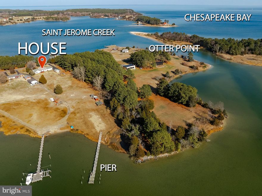 If you've been looking for peace and tranquility then this waterfront ranch-style home is for you. With front AND back views of St. Jerome Creek, every room is special.  Built in 1997, this well-maintained residence welcomes you with a spacious foyer that leads to the formal living room on the front of the house and the family room off the back. The kitchen has been updated with a beachy theme adding counter space for elaborate meals, storage and breakfast area. The formal dining room will host many guests and the mudroom gives you easy access to the backyard. The other side of the home boasts 3 well appointed bedrooms, all with large closets and views. The primary bedroom includes a luxury bathroom, walk in closet plus 2 additional closets and a picture window overlooking the creek and yard. The attached garage gives you staired access to the huge attic and the crawl space with concrete flooring  Outside, the property is all about casual creek living. With a boathouse for your watercraft and fishing/crabbing supplies, shed for storage and a detached garage used as a cottage in previous years., you can enjoy peaceful views and the soothing sounds of nature right from your backyard or the pier where you can tie off up to 2 boats.  This home is not just a place to live; it's a lifestyle.