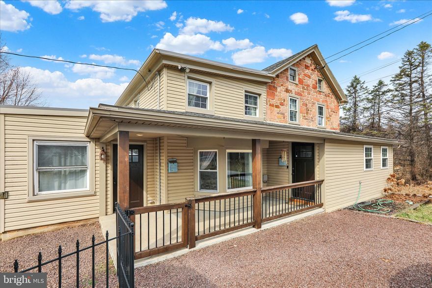 Property is being sold by Public Auction April 30th at 6PM. The list price is the opening bid only and does not represent the final sales price.  Property is being sold as-is. A 5% deposit is required the day of the auction and closing must occur within 45 days. This one‑of‑a‑kind 1849 stone farmhouse has been fully restored with extraordinary care, offering a rare blend of historic character, modern comfort, and breathtaking acreage across approximately 19.27 serene acres in Robeson Township. The main level offers a welcoming flow through the kitchen, living room, dining room, office, powder room, and main‑floor laundry. The main floor also offers a private in-law suite which provides exceptional flexibility with its own bedroom, full bathroom, kitchenette, and separate entrance. Ideal for multigenerational living, guests, or extended stays. Upstairs you’ll find three charming bedrooms and a full bathroom, accented by original hardwood floors rich with character. Outside, the peacefulness of the property unfolds around you. The original springhouse, which supplied water to the home until just a few years ago, still offers an active water source and stands as a beautiful reminder of the property’s history. A barn with livestock stalls and a fully fenced pasture is ready for animals, while a 40x24 pole building (with 100 amp electric service) provides abundant storage or workspace. The land itself is a stunning mix of wooded acreage and tillable acres, offering endless possibilities for farming, livestock, recreation, or simply enjoying the outdoors. A picturesque, stocked pond adds to the tranquility - perfect for quiet evenings spent fishing and watching wildlife drift across the landscape. This home has been thoughtfully updated inside and out, including a new septic system installed in 2020. Located in the Twin Valley School District with convenient access to major routes, this lovingly restored farmhouse offers privacy, versatility, low taxes, and a lifestyle that feels both grounded in history and full of possibility. Properties like this are truly rare, and this one has it all.
