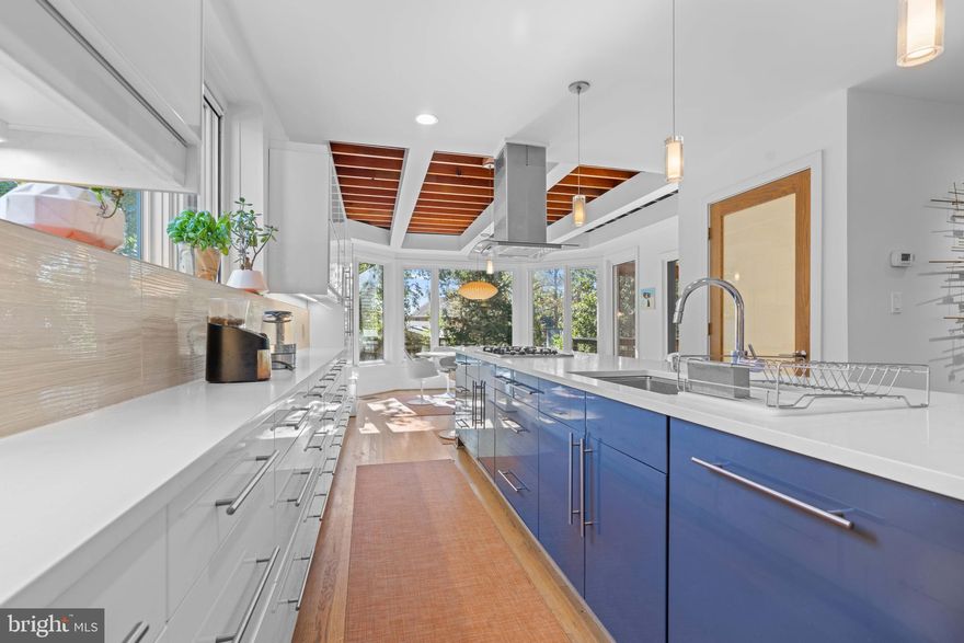 This Lyon Park classic brick colonial is truly ONE OF A KIND! This home is the TOTAL PACKAGE! Incredible walkability with Clarendon, Lyon Park Community Center, and Long Branch Elementary just a few blocks away.   Once inside you will see the beautiful transformation that was completed by LAB architecture.  The modern renovation brings in fantastic angles and oversized custom windows welcoming an abundance of natural light!  The open floor plan showcases a gourmet kitchen with custom cabinetry and a HUGE center island that is perfect for entertaining.  The kitchen has a spacious dining area with an open beam ceiling and beautiful big windows overlooking luscious green space in the fenced-in backyard.  Connected to the kitchen is a large screened-in porch with skylights and ample space to make it a second living room.  In addition, you will find a TREX deck alongside the screened-in porch. With plenty of outdoor space, you will treasure this peaceful retreat to relax and enjoy every evening - a rare find so close to DC!  The top floor was also renovated and has 3 large bedrooms. The primary bedroom features vaulted ceilings with skylights and a tremendous amount of storage and built-in cabinets.  The two full bathrooms are modern and updated with excellent tile work! Also, TOP floor W/D! The lower level has the potential to be a rental unit or guest suite.  It has a bedroom, full bathroom, outside entrance, W/D, living room, and kitchenette.  Additional highlights include WHOLE house water filtration system, W/D 2021, jetted bathtub, large driveway plus street parking, freshly painted, landscaped, custom window treatments, Andersen awning & Lincoln casement windows, Artemide sconces and MORE! Come and see it in person to be blown away! You won't find anything like this in Arlington under $1.5m!