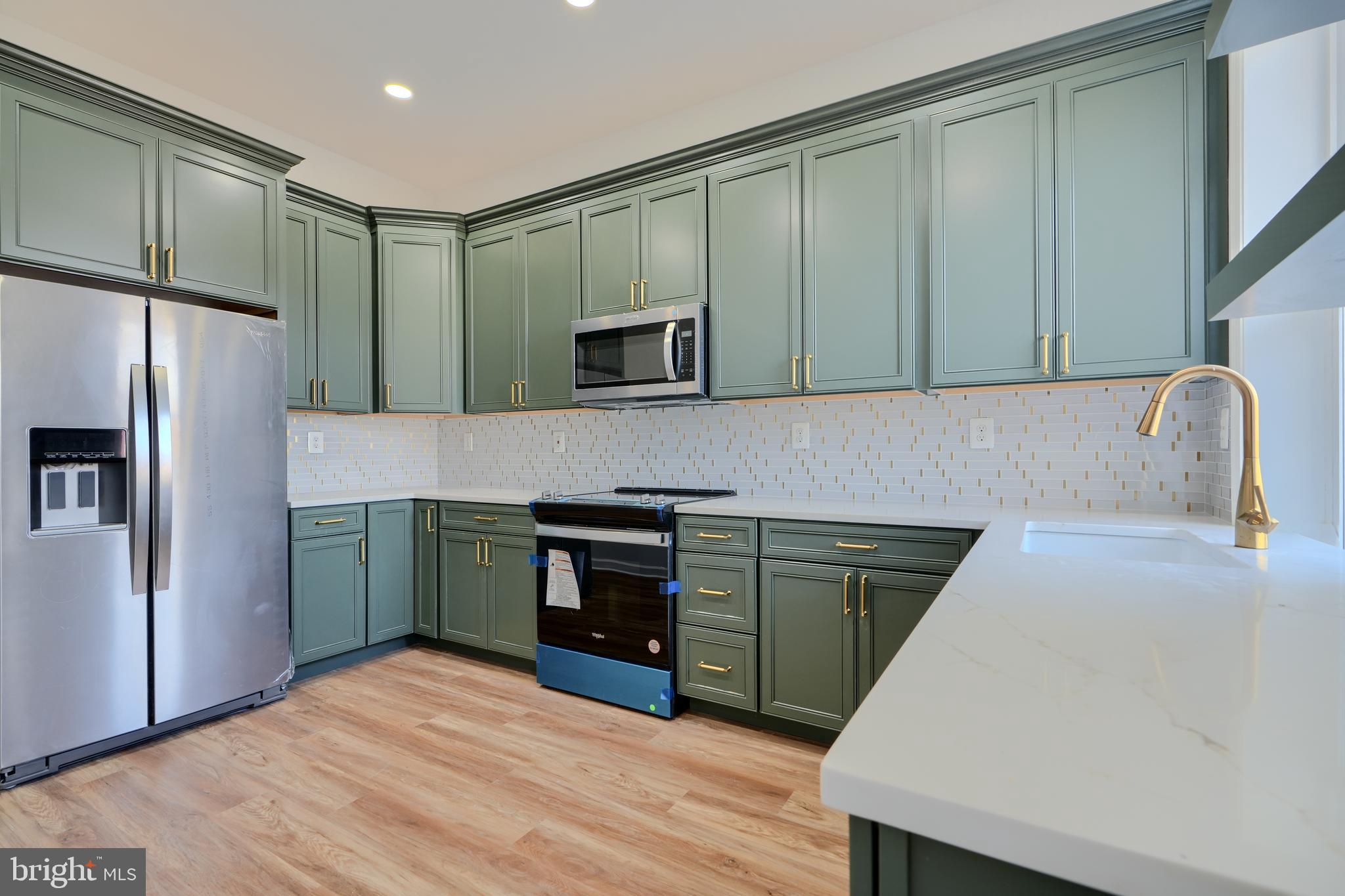 $10,000 Price Reduction! Seller is highly motivated – bring your offers! Don’t miss this opportunity to own a beautiful home at an even better value. Take advantage of up to $24,500 in grants and seller assistance! This home qualifies for the $10,000 Vacants to Value grant, the Johns Hopkins Live Near Your Work grant up to $14,500, and seller help with down payment and closing costs—making homeownership more affordable than ever!
Experience the Warmth and Elegance of This Meticulously Renovated Row House in Broadway East. Discover the perfect blend of luxury and convenience in this beautifully renovated row house, nestled in the vibrant Broadway East neighborhood. Boasting four bedrooms and three and a half bathrooms across three spacious levels, this home offers exceptional comfort and modern sophistication. Upon entry, you’re greeted by a striking spiral staircase that sets the tone for the stunning interior. The main floor features soaring ceilings, elegant luxury vinyl flooring, and an open-concept gourmet kitchen equipped with sleek stainless steel appliances and dazzling quartz countertops—ideal for both everyday living and entertaining. The second level offers two generously sized bedrooms, including one with a stylish en-suite bathroom, while the upper level is home to the primary suite with a walk-in closet and an additional bedroom, also featuring a walk-in closet. The unfinished basement presents a fantastic opportunity for a rental unit or additional living space, and a newly constructed deck enhances the outdoor experience.
Conveniently located near downtown Baltimore and the cutting-edge Johns Hopkins medical facilities, this home offers easy access to work, dining, and entertainment. Even more enticing, it qualifies for a variety of homebuyer incentives, including the Vacants to Value grant, the Live Near Your Work grant, and other down payment assistance programs, making it an outstanding opportunity—especially for first-time homebuyers. Don’t miss your chance to own this stylish and spacious home, where modern elegance meets everyday convenience. Schedule your showing today!
