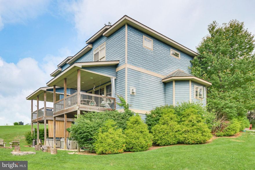 If being located in the heart of Deep Creek Lake is a must for you, this is your home. Offering three levels of living space, two master suites, hardwood flooring, granite counter tops, propane fireplace and an open floorplan. The outside space offers a great covered porch off of the main living area, and a nice lower level patio that boasts a hot tub and a firepit for your enjoyment. You can enjoy views of Wisp Ski Resort and some seasonal lake views. This home won't last long, call today to preview.