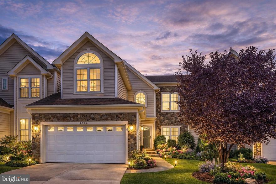 Welcome to this beautifully maintained Carriage Home nestled in the highly sought-after South Riding community. Offering over 3,900 square feet of thoughtfully designed living space across three levels, this residence perfectly blends comfort, elegance, and functionality.

Step inside to discover a bright and spacious main level featuring a separate living room, formal dining area, and a sunroom—ideal for both everyday living and entertaining. The living room is filled with natural light, creating a warm and inviting ambiance. The adjacent dining space provides ample room for gatherings and special occasions.

The gourmet kitchen is a chef’s delight, complete with appliances, granite countertops, a cooktop, wall oven, and abundant cabinetry for storage and organization.

Upstairs, the expansive primary suite offers a private retreat with a luxurious en-suite bathroom featuring dual vanities, a soaking tub, separate shower, and generous closet space, including a walk-in closet. Additional bedrooms on this level are well-sized and versatile—perfect for family, guests, or a home office.

The fully finished walkout basement adds incredible flexibility, featuring a bonus room ideal for a recreation area, office, or guest suite,  and direct access to the backyard.

Recent updates include brand new carpet and fresh paint, making this home truly move-in ready.

Residents of South Riding enjoy access to exceptional community amenities, including a clubhouse, swimming pools, playgrounds, and scenic walking trails. Conveniently located near shopping, dining, and major commuter routes, this home offers both tranquility and accessibility.