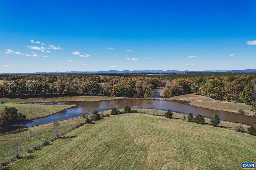 Stunning mountain view lot on over 26 acres just outside of Charlottesville, Virginia. This lot has gently rolling terrain, multiple build sites with expansive mountain views, and frontage along two large ponds. This lot has a well already drilled for your convenience, has been perked for a 6 bedroom conventional drain field, and a recent survey recorded. This is truly a turn key building lot for the home of your dreams. Underground electricity available with CVEC, and high speed fiber optic internet available through Firefly.   This is Lot #20 within Oakwater Estates, a new development with high acreage lots in both Fluvanna and Albemarle County. There is no HOA, and bringing your own builder is welcome and expected.   Minutes from renown wineries and approximately 25 minutes from downtown Charlottesville.      The Timbers Group has direct ownership interest in Oakwater Estates. This ownership disclosure is made and pursuant to Virginia Law section 54.1-2138.2.,Lot 20 Oakwater Estates