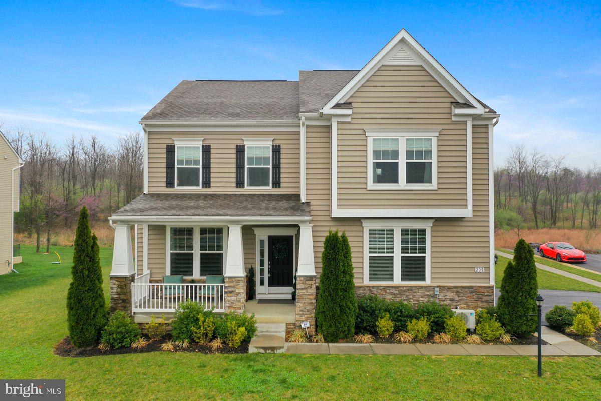 Welcome to 209 Klee Dr! This beautiful and well-maintained home is the former model in the sought-after community of Martinsburg Station. Featuring 4 spacious bedrooms and 3.5 bathrooms, this colonial-style home offers timeless appeal and modern comfort. Enjoy elegant hand scraped wood flooring on the main level, an open-concept kitchen with granite countertops and stainless steel appliances, and a luxurious primary suite with a soaking tub, walk-in shower, and generous closet space. The wide oak staircase with black iron railing adds a stunning touch to the home’s design. The basement is 90% finished with walk-up access and includes a flex room with an additional unfinished room that can easily be transformed into a guest room, home gym, or office. High-speed internet is available—ideal for remote workers and gamers. Situated on a premium lot directly across from the clubhouse, take advantage of community amenities including a pool, clubhouse, walking trails, and stocked catch-and-release ponds. Conveniently located near I-81, shopping, dining, and recreation, this home is perfect for commuters. Why wait for new construction? Schedule your private tour today!