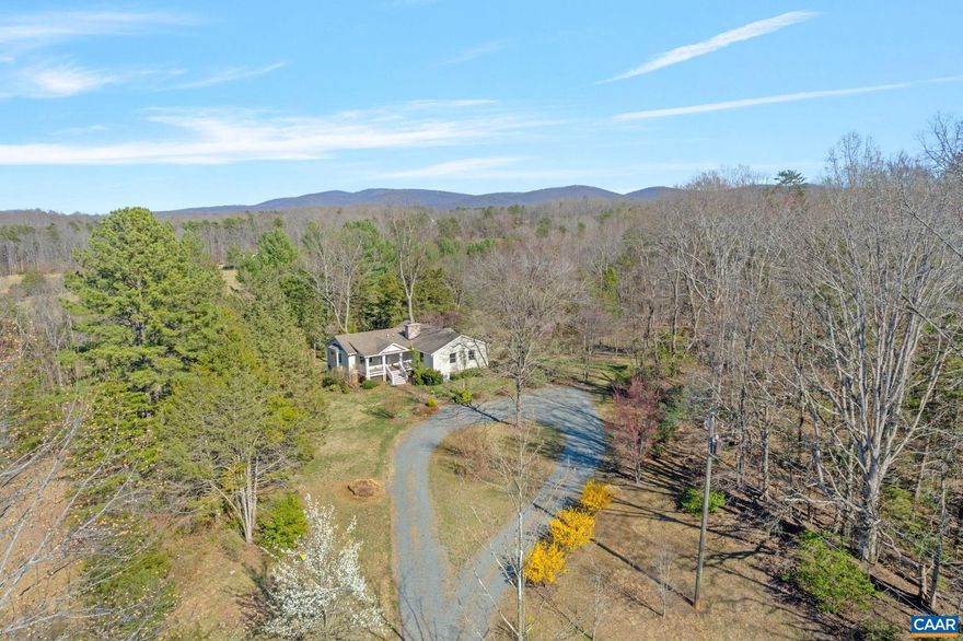 Welcome to your private retreat on 5 breathtaking acres, certified as a wildlife habitat backing up to a conservation easement?perfect for nature lovers! This 3-bedroom, 2.5-bath home offers main-level living at its finest along with countless upgrades. The spacious family room addition (2013) features soaring ceilings, hardwood floors, & a custom office with built-ins. The kitchen is a delight, with Corian & Quartz countertops, elegant cherry cabinets, & plenty of prep space. Cozy up in the dining room by the fireplace or relax on the screened-in porch, Trex decks, or patio, soaking in the serene surroundings. Thoughtfully designed for modern living, the home boasts a newly replaced water heater (2021), a propane hot water boiler, mini splits for cooling (two replaced in 2024), & a septic system pumped in 2023. Additional highlights include a water filtration system, blue light filters, & tons of storage, including a finished basement with a rec room, bedroom, full bath, laundry, & a large storage room with double doors. With a Hardiplank and stone exterior, a garden shed, and a roof updated in 2013, this home offers functionality and charm. Conveniently located near NGIC and town, this property is ready to welcome you home.,Cherry Cabinets,Quartz Counter,Solid Surface Counter,Fireplace in Basement,Fireplace in Dining Room