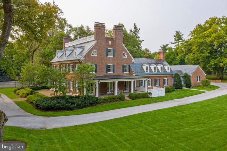 Town and Country living outside of Philadelphia. 375 N Spring Mill Rd is the perfect fusion of The Ultimate Location and the Ultimate in Luxury living. Located in the prestigious estate section of Villanova on Spring Mill Road, this gated oasis is situated in the very heart of Philadelphia's coveted Main Line. The property features over 2.5 flat and meticulously landscaped acres, a tennis court, mature old growth trees, and a spectacular antique brick herringbone entrance patio. Seamlessly blending old with new, the crown jewel of the outdoor space is the dramatic addition of a 1700 sq foot flagstone patio, complete with a 15 foot outdoor stone fireplace with hearthside seating, and built in grill. This stunning Georgian home offers the ultimate in lifestyle living. The tall, perfectly manicured rows of Arborvitae trees lining the property give the feeling of a hidden private enclave within, yet just outside its perimeter is immediate access to all that the Main Line has to offer. The property can be accessed easily from 2 driveways - the gated front entry off of Montgomery Avenue or the quiet private lane behind the house, off of Spring Mill Road. The prominent location is only nine miles from Philadelphia, and walkable to the Villanova train station, and so affords supreme convenience for traveling to Philadelphia or New York City and beyond. Originally part of the Walnut Hill estate, which still exists today, 1632 was divided into its own parcel in 1909. A historic plaque noting this date adorns the side of the home. With a gorgeous, stately entrance fronting Montgomery Avenue, the rear of the home offers a wonderful neighborhood feel. Down the small lane behind the house are eight other private homes for trick or treating or socializing. Just beyond the end of the lane is yet another family neighborhood with direct walking access to Villanova University, Bryn Mawr and more. Inside the home is updated to perfection, with large rooms that easily flow from one to the other. Each of the main level living spaces has French doors that open to covered porches and expansive terraces. The home underwent a comprehensive renovation in 2008, which upgraded everything: a new slate roof was added, along with copper gutters, all new windows, new updated electrical with 400 amp service, new plumbing, top of the line zoned heating and central air, and whole house generator (added in 2015). The state of the art technology and home automation system provides complete audio, lighting, and entertainment control for the truly modern experience. Old world workmanship and high ceilings blend seamlessly with the chic décor and modern kitchens and baths. The current owners have spent the last 12 years updating and modernizing the home, so that it has the unique characteristics of a showplace inside and out, but also offers the comforts of a family home. Though this home is stately, when you walk in you immediately feel the cozy, casual, and very hip vibe. (See attached fact sheet on rooms for more specific information)