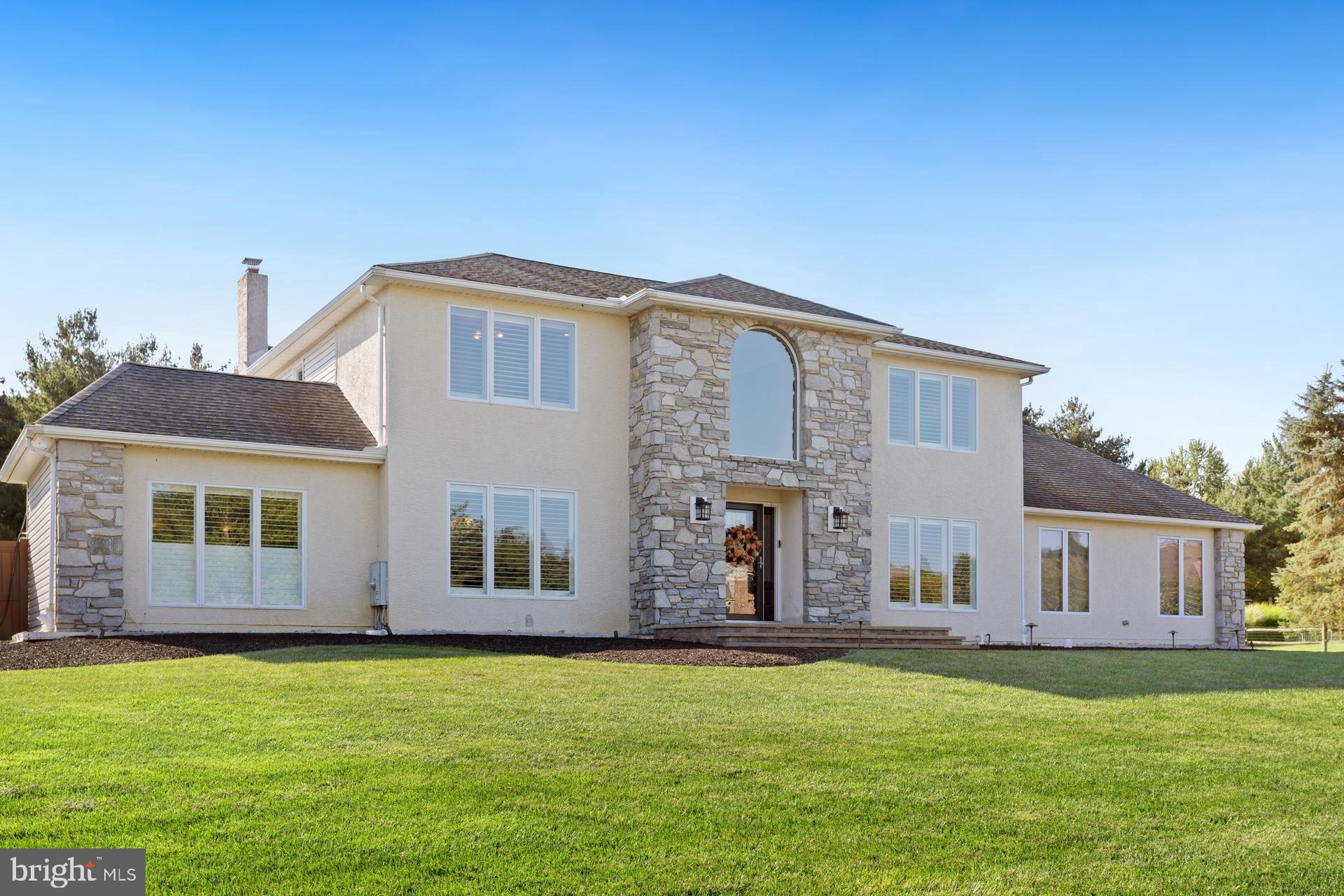 Welcome to this beautifully upgraded 4-bedroom, 2 full and 2 half bath Center Hall Colonial, nestled in a desirable Richboro neighborhood and located within the top-rated Council Rock School District. This exceptional home blends timeless elegance with modern luxury and offers an ideal layout for both everyday living and entertaining.
Step into a grand foyer flanked by a formal dining room and a versatile living room—currently used as a recreation space. The heart of the home is the chef’s kitchen, designed with high-end finishes and functionality in mind. Highlights include a massive center island, GE Monogram stainless steel appliances, an 8-burner gas range, granite countertops, a Butler’s pantry, and a built-in coffee bar.
Adjacent to the kitchen, the inviting family room features a classic wood-burning fireplace and a custom wet bar complete with a built-in ice maker—perfect for entertaining. A first-floor office with custom built-in wood shelving offers a quiet retreat for working from home.
Upstairs, the spacious primary suite is a true retreat, featuring a luxurious ensuite bath with his-and-her sinks, a jetted soaking tub, a separate stall shower, and a large walk-in closet with a dedicated dressing area. Three additional bedrooms and fully renovated bathrooms provide comfort and style for the whole family.
The finished basement adds even more living space—ideal for a playroom, home gym, or more.
Step outside to your private backyard oasis—completely fenced and thoughtfully designed with extensive hardscaping, paver patios, and a large covered outdoor living area ideal for relaxing or entertaining year-round.
Additional upgrades include Siding (2021) , Stucco (2018), Windows ( 2018 & 2021), Doors ( 2018) , HVAC systems (2018 & 2022) , Custom Blinds and a whole-house generator (2019) for added peace of mind.
Don’t miss this rare opportunity to own a move-in ready home with luxury finishes, exceptional indoor and outdoor living spaces, and a prime Bucks County location. Schedule your private showing today!