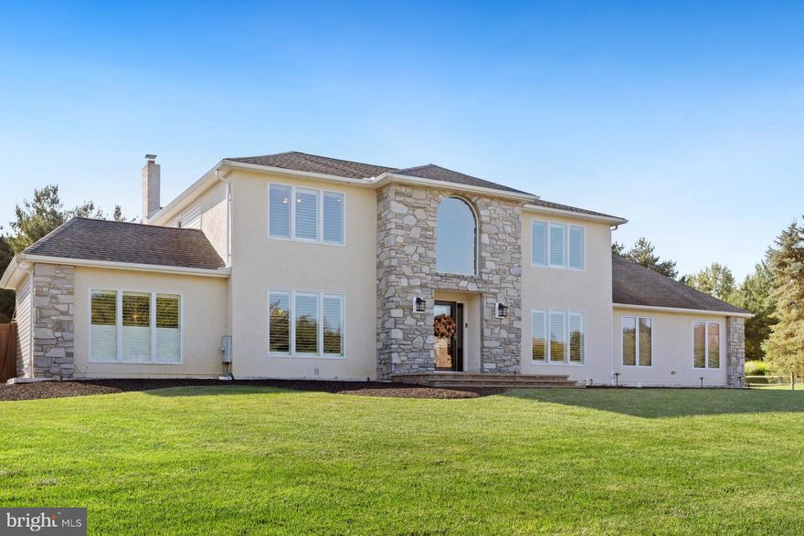 Welcome to this beautifully upgraded 4-bedroom, 2 full and 2 half bath Center Hall Colonial, nestled in a desirable Richboro neighborhood and located within the top-rated Council Rock School District. This exceptional home blends timeless elegance with modern luxury and offers an ideal layout for both everyday living and entertaining.
Step into a grand foyer flanked by a formal dining room and a versatile living room—currently used as a recreation space. The heart of the home is the chef’s kitchen, designed with high-end finishes and functionality in mind. Highlights include a massive center island, GE Monogram stainless steel appliances, an 8-burner gas range, granite countertops, a Butler’s pantry, and a built-in coffee bar.
Adjacent to the kitchen, the inviting family room features a classic wood-burning fireplace and a custom wet bar complete with a built-in ice maker—perfect for entertaining. A first-floor office with custom built-in wood shelving offers a quiet retreat for working from home.
Upstairs, the spacious primary suite is a true retreat, featuring a luxurious ensuite bath with his-and-her sinks, a jetted soaking tub, a separate stall shower, and a large walk-in closet with a dedicated dressing area. Three additional bedrooms and fully renovated bathrooms provide comfort and style for the whole family.
The finished basement adds even more living space—ideal for a playroom, home gym, or more.
Step outside to your private backyard oasis—completely fenced and thoughtfully designed with extensive hardscaping, paver patios, and a large covered outdoor living area ideal for relaxing or entertaining year-round.
Additional upgrades include Siding (2021) ,  Stucco  (2018),  Windows ( 2018 & 2021), Doors ( 2018) ,  HVAC systems (2018 & 2022) , Custom Blinds and a whole-house generator (2019)  for added peace of mind.
Don’t miss this rare opportunity to own a move-in ready home with luxury finishes, exceptional indoor and outdoor living spaces, and a prime Bucks County location. Schedule your private showing today!