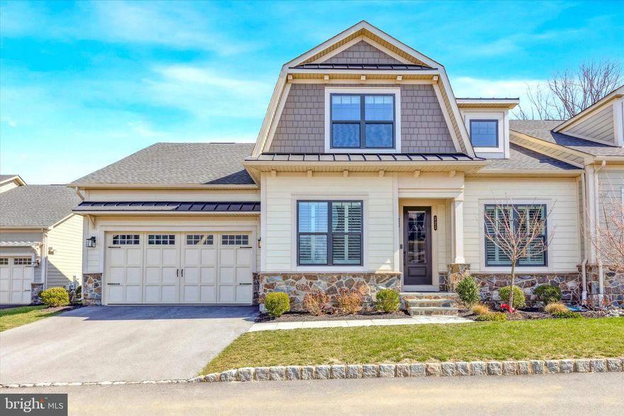 Welcome to 325 Ap Even Road.  This stunning, better than new, carriage home is located on a premium cul-de-sac lot in the desirable Wayne Glen community recently completed by NVHomes.  This home offers 4,400 square feet of luxurious living space spread across three open levels, four bedrooms, four full bathrooms, a finished basement with full bathroom, a two-car front entry garage, upgrades galore, tasteful finishes, and an awesome flagstone patio off the back of the home.   The gorgeous exterior consists of maintenance free Hardie Plank siding, thin cut real stone veneer, standing seam metal accent roofs, an attractive color palate, flagstone walkway, and a carriage style garage door with decorative hardware.  The first floor includes: pub room off foyer with custom cabinetry (this could also be used as a formal dining room); family room with vaulted ceiling; mudroom off garage entrance with custom cubbies, a guest bedroom, a full hall bathroom, and an office with double 15 lite glass doors and transom window.  The main attraction is the gorgeous gourmet kitchen with handsome white cabinetry, stainless steel appliances, quartz countertop, center island with single bowl sink, dishwasher, pendant lighting, and overhang seating for four, subway tile backsplash, and a pantry for storage.  An adjacent breakfast room has matching cabinetry, countertops, and backsplash along with a French patio door with transom window leading to the rear patio.  There’s also a first-floor primary bedroom suite consisting of sleeping area with tray ceiling, walk-in closet professionally installed by Closets by Design, and a spa-like bathroom with two vanities, soaking tub with tile surround, stall shower with tile floor, floor to ceiling tile, and frameless glass enclosure, and a private water closet.  The second floor has a bedroom with two closets, full bathroom with tub and tile surround to ceiling, a private loft area with closets, and another finished room that could be used as a 2nd office or storage.  The finished lower level is massive and currently has a gym, recreation room, bedroom with Closets by Design closet, full bathroom, laundry area, mechanical room, and plenty of unfinished space for storage.  Other interior features include wide plank engineered hardwood floors throughout most of the 1st floor and 2nd floor hallway, plantation blinds on 1st floor windows, abundant recessed lighting throughout, and fresh, neutral wall colors.  The rear flagstone patio will be your outdoor oasis offering a thin cut stone veneer knee wall with flagstone cap, outdoor kitchen consisting of built-in grill and refrigerator, plenty of space for couches/tables, a flat screen TV mount, and professional landscaping all overlooking scenic common space.  This property is completely move-in ready and the next owners will be lucky to call it home!  Conveniently located close to all major commuter routes, shopping, dining, and part of the top rated Tredyffrin Easttown School District.  This is the one you’ve been waiting for.