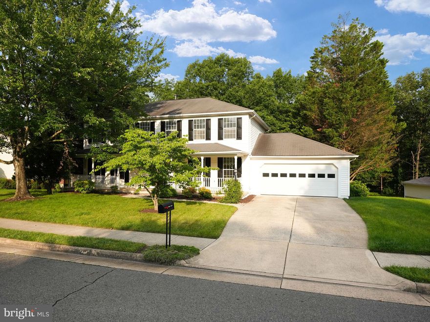 BACK TO MARKET! This wonderful colonial in Confederate Ridge II is just waiting for you to call it home! Covered front porch, two car garage, walk out basement and private rear yard with deck are only the beginning! Main level offers center floor foyer, formal living room, dining room, refreshed kitchen with eat in table space, family room with fireplace and door to rear deck, powder room and mud room entry off the garage. Upper level with primary suite, hall bath and four additional bedrooms. Lower level rec room with SGD to rear yard, bonus room, game area, full bath, laundry room and large storage/ utility room. This home is move in ready! Brand new carpet, paint and HVAC. Other upgrades throughout the home. Easy access to commuter routes.