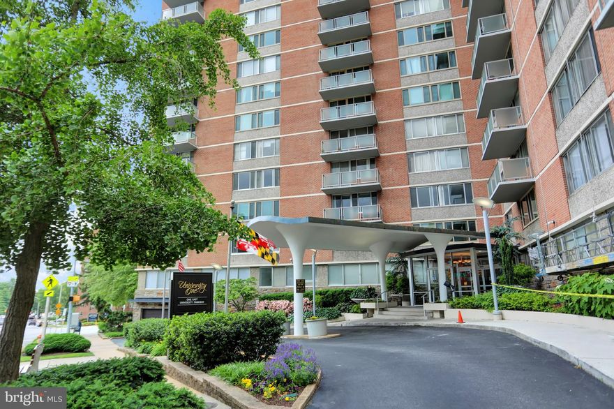 2 Bedroom, 2 Bath condo conveniently located near John Hopkins Homewood Campus. This unit features a living room/dining room combo, a galley kitchen, balcony, an en-suite owners suite with walk-in closet. Condo fees include electric, water, sewer, trash, roof top pool, elevator, 24-hour front desk security. Other amenities include fitness center, community room, guest suites and garage parking. Windows  and balcony sliding doors were replaced 2021. Close to Union Memorial, JH Campus, restaurants and so much more.