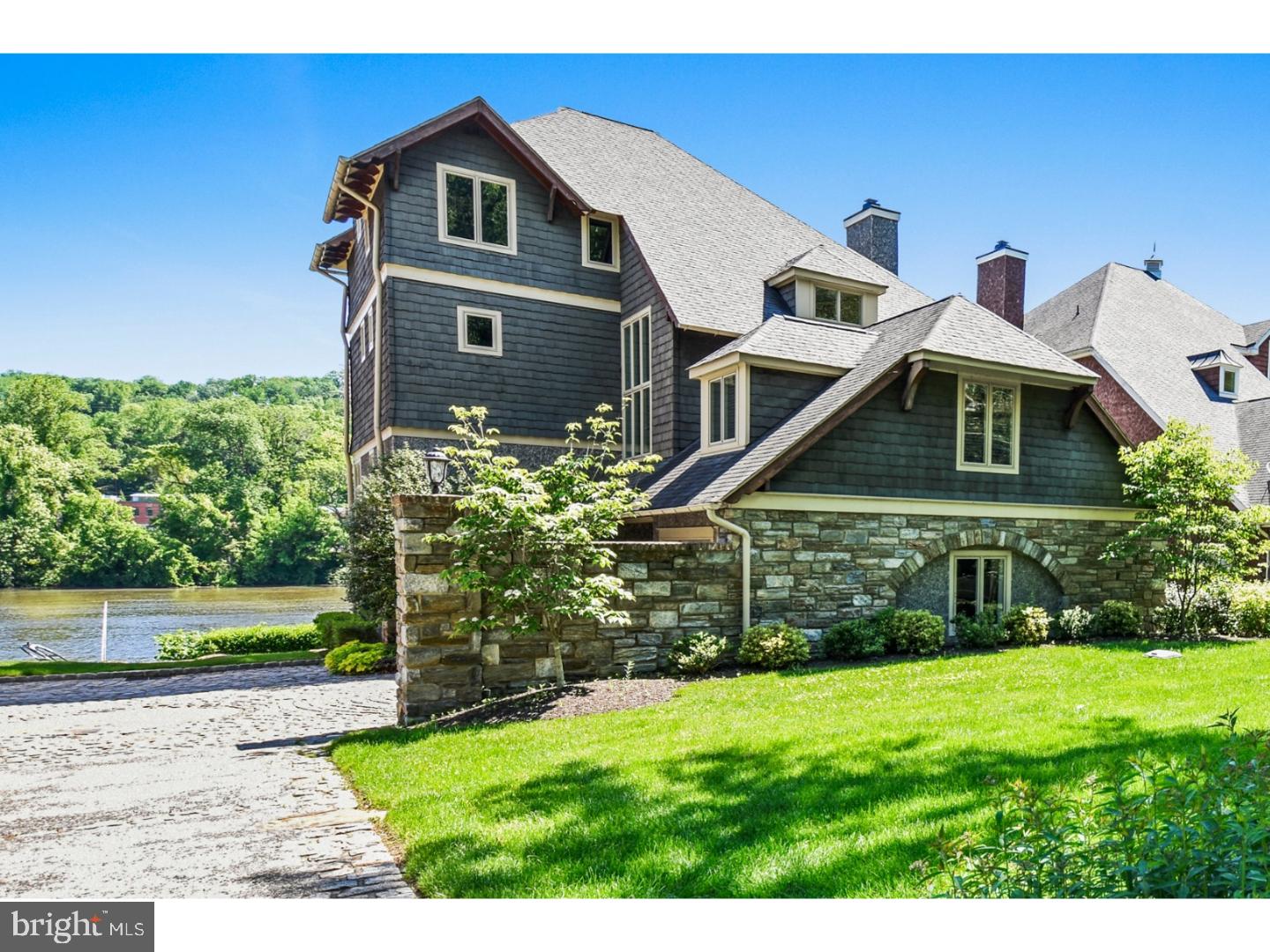 Amazing luxury riverfront home available in Gladwyne. Relish the serenity of living on the water in your private retreat. This gorgeous 4 level home with 4 bedrooms and 4.5 baths has it all! With three outside decks and wall to wall windows, you'll enjoy entertaining or relaxing while taking in the breathtaking views of the Schuylkill River. The Main Level features an open floor plan including Living Room with gas fireplace, built-in bookshelves and French doors leading to a large deck. The Cook's Kitchen which is open to the informal Dining Room is all high end, including granite, Wolfe, Viking, Subzero appliances, including 2 Bosch dishwashers . There is a large island with seating for 3-4. This home offers 2 Master Bedrooms, each with spacious walk-in closets, private decks overlooking the river, and gorgeous Bathrooms with marble and stone finishes, separate seamless glass showers, one with a bubble jetted tub and one with a sweet heart tub. The 3rd and 4th Bedrooms offer beautiful Bathrooms and an abundance of closet space.Bonus office can also be found. Additionally, there are oak hardwood floors throughout,10 foot ceilings on the main level, 9 ft. ceilings on the others, and magnificent custom 8ft doors throughout. Energy efficient, this home boasts geothermal heating and air conditioning. Some other special features of this home include radiant heat under floors throughout 1st floor, in entry way, both master bathrooms and garage; central vac; security system; outside sprinkler system; intercom and indoor outdoor speakers. A two-car Garage, a Boat Garage, and private dock complete this home. Fantastic location- minutes from shops, restaurants, major highways,10 miles to Center City and short ride to King of Prussia. Must see!