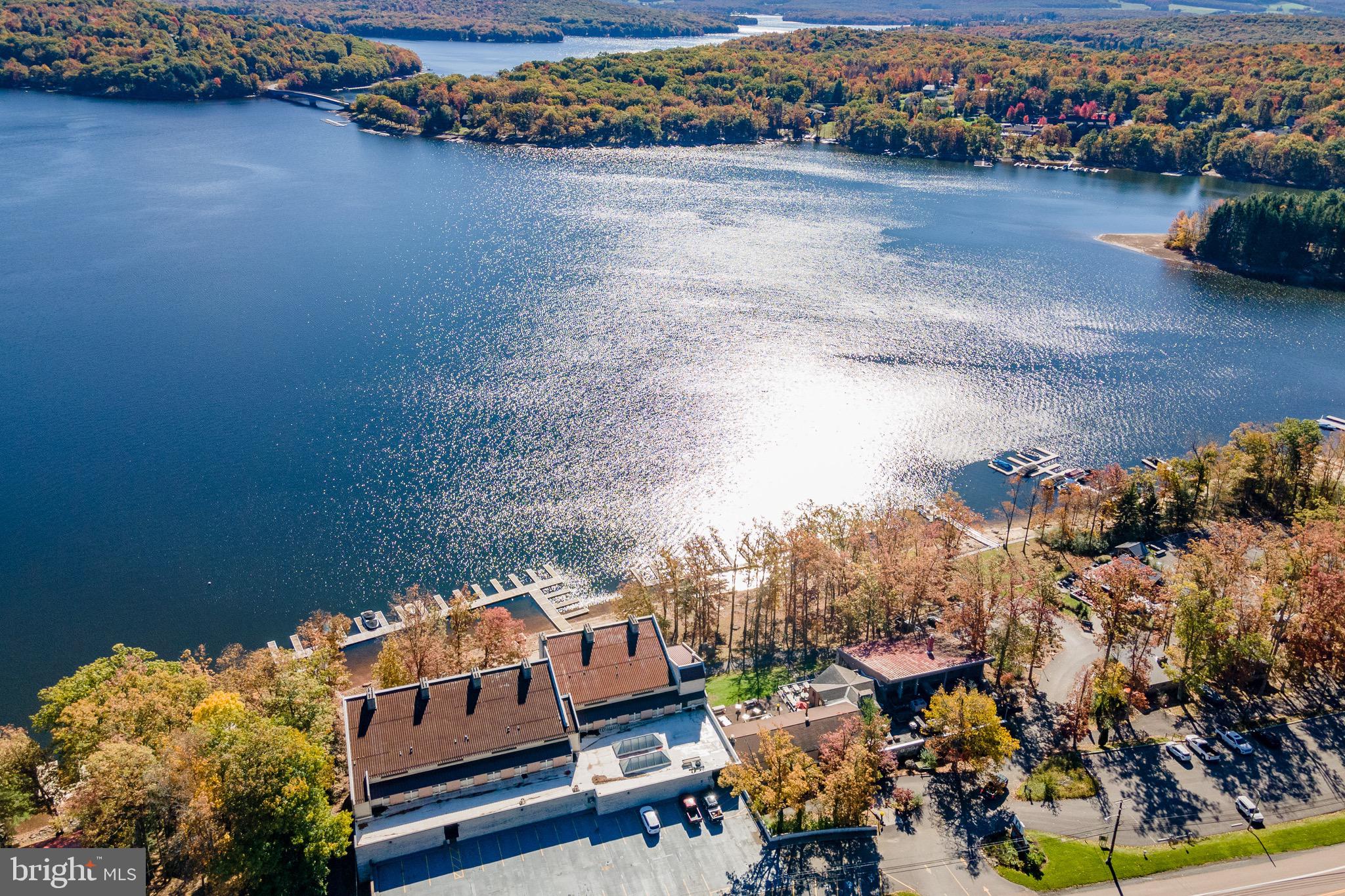 Experience lakefront living with this charming two-level condo at Will O the Wisp at Deep Creek Lake! Offering 2 bedrooms and 1 full bathroom, it captures breathtaking lake views from both levels. The main floor features a functional kitchen and a cozy living area with a wood-burning fireplace—perfect for relaxing after a day on the water. Upstairs, you’ll find two comfortable bedrooms and a full bathroom. Community amenities include an indoor swimming pool, fitness center, sandy lakefront beach, and the option for boat slip access through the association. Plus, you’re just steps away from local favorites like Ace’s Run and Firewater Kitchen & Bar. Whether you’re seeking a weekend retreat or a year-round getaway, this condo offers the perfect opportunity to make your own mark at Deep Creek Lake.