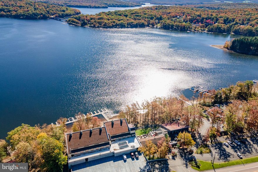 Experience lakefront living with this charming two-level condo at Will O the Wisp at Deep Creek Lake! Offering 2 bedrooms and 1 full bathroom, it captures breathtaking lake views from both levels. The main floor features a functional kitchen and a cozy living area with a wood-burning fireplace—perfect for relaxing after a day on the water. Upstairs, you’ll find two comfortable bedrooms and a full bathroom. Community amenities include an indoor swimming pool, fitness center, sandy lakefront beach, and the option for boat slip access through the association. Plus, you’re just steps away from local favorites like Ace’s Run and Firewater Kitchen & Bar. Whether you’re seeking a weekend retreat or a year-round getaway, this condo offers the perfect opportunity to make your own mark at Deep Creek Lake.