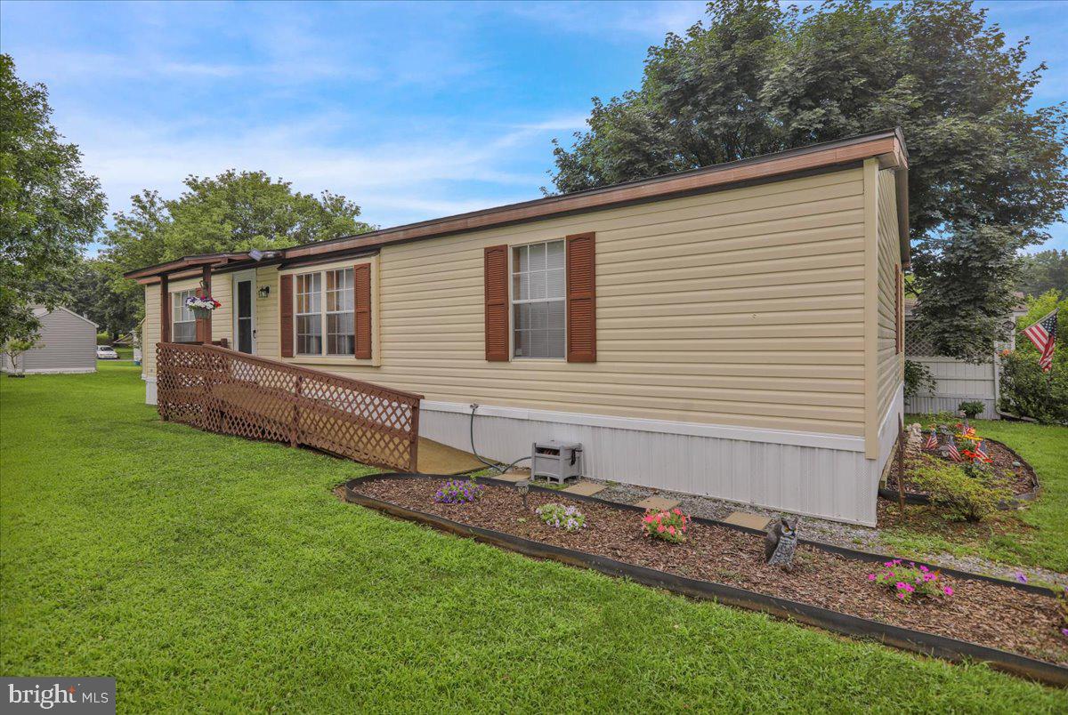 Affordable living at its finest! Looking for easy one-floor living in Northern Berks County? Come check out 703 1st Street EXT in Hamburg (Tilden Twp.); this move-in ready home offers three good-sized bedrooms, two full bathrooms, open living room, dining room and kitchen area, and a rear deck perfect for enjoying some time outdoors. Very well maintained and many updates, including a new roof (2025), fresh paint and kitchen backsplash (2025), plumbing completely redone (including main, 2023), hot water heater (2022), and HVAC (2016).
The lot (rented) is easy to maintain and a good sized shed stays with the sale. The lot fee is $630.- and includes water, sewer, and trash. Two off-street parking spaces and a ramp to the front door add to your convenience. This mobile home is fully approved with financing available! Schedule your showing and see this 100% turnkey property today!