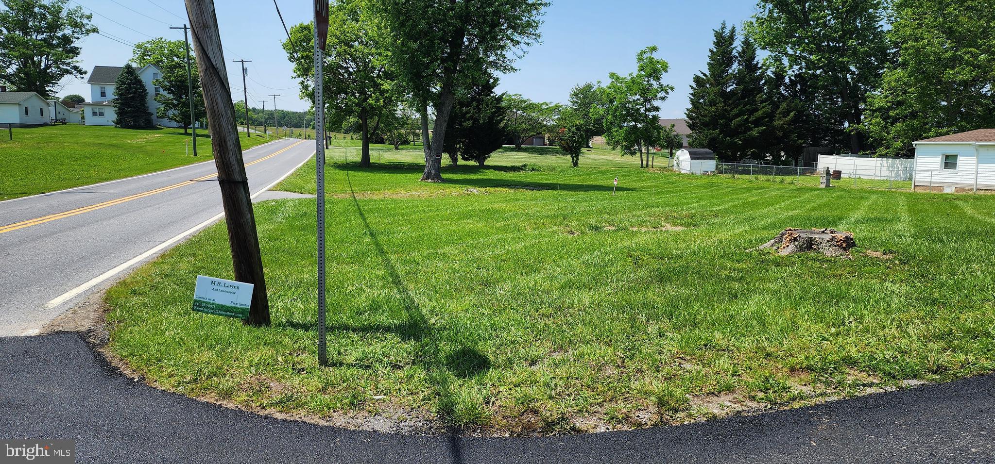 LOCATION! LOCATION! LOCATION! Affordable and adorable. Close to a half acre of land (two parcels are combined on one deed: parcel 1 is 0.24 acres and parcel 2 is 0.17 acres) conveniently located minutes from Interstate and major shopping. Public Water is available. Lot is perfect for buyers who prefer a more minimalistsic approach like the "compact house concept", as the building will be restricted to a small two bedroom home of roughly 600 square feet. This was determined by the MDE following site evaluation for septic installation. Please call for additional information/documention. Adding a garage may be a possibility. Much of the research has already been done for the new owner, and the area for the septic mound has been staked by C.R. Semler Septic. In addition, the lot was cleared by the current owner - the old fallen down structure, that used to be a house, was demolished and removed; and niusance trees were cut down. This equates to big savings for the new owner. Bring your vision, bring your builder. Mobile homes are no longer permitted in the Rural Village (RV) zone. Please note that due to the septic area being staked, potential buyers need to be accompanied by an agent when accessing the property. Septic information can be provided upon request.