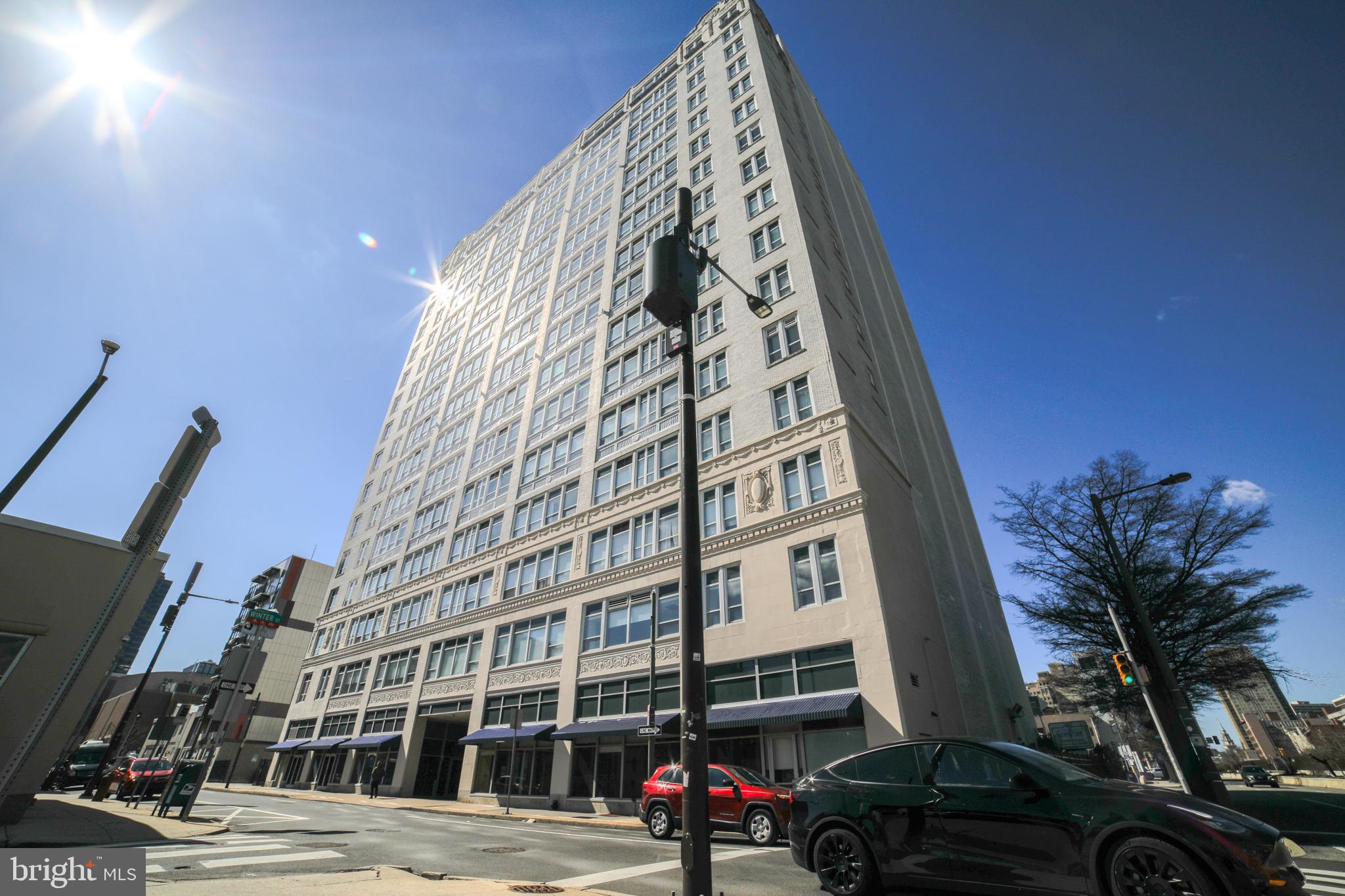Welcome to The Grand View Condominiums, a modern, well-kept high-rise located in the heart of Philadelphia’s famed Chinatown neighborhood. Unit #403 is a bright, airy and updated, 1 bed, 1 bath condo with stunning views of Center City! Featuring a simple layout with spacious living room, hardwood floors and a galley kitchen with ample storage and a large island offering seating for 4. The sundrenched primary suite is highlighted by extra tall windows with western facing views, wall to wall carpeting and a large owner’s closet. A separate full bathroom with clean, white tiling, tub shower and separate vanity with additional storage is the cherry on top. This unit comes with a private basement storage unit. The building amenities include 24/7 front desk security, fitness center, dog run and laundry. Chinatown is one of the most exciting neighborhoods in the city. Bustling with life, world renowned cuisine, local markets, entertainment and many shopping opportunities. With a walk score of 99 and minutes from the Fashion District, Reading Terminal Market, Franklin Square Park and City Hall. Easy access to public transit, Broad Street and all major highways. Schedule your tour today, this one won’t last long!