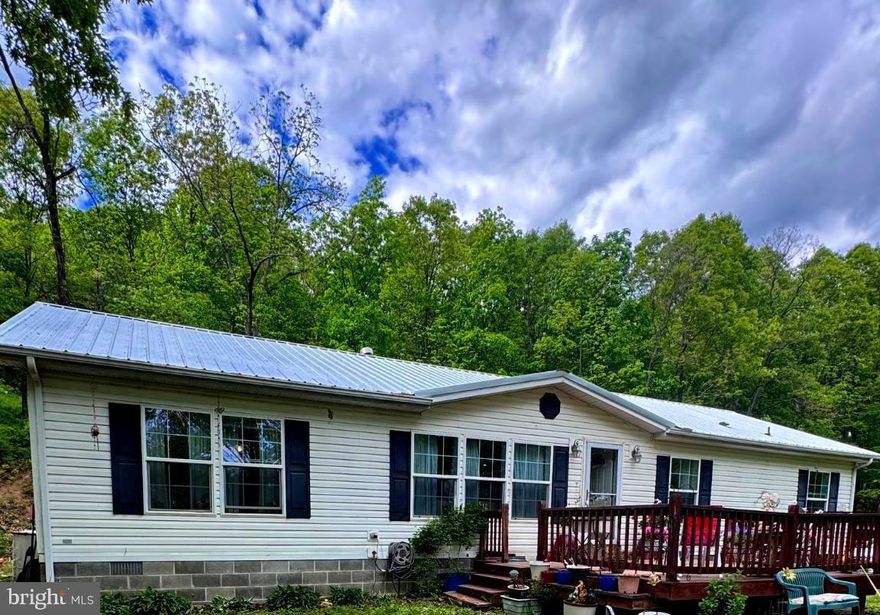 Escape to the beauty of the mountains with this incredible West Virginia property offering the perfect blend of country living, privacy, and opportunity. Situated on 28.31 acres of beautiful wooded mountain and farm land, this unique property features a charming 3-bedroom, 2-bath home surrounded by breathtaking panoramic views and peaceful natural scenery.
Horse lovers and outdoor enthusiasts will appreciate  the open land, and endless possibilities for recreation, farming, or simply enjoying the quiet mountain lifestyle. Also included is a separate 2-bedroom, 1-bath mobile home — ideal for guests, extended family, rental income, or a private getaway space. Also included is a barn and several outbuildings.
Conveniently located near some of West Virginia’s most stunning natural attractions, including Seneca Rocks, Dolly Sods Wilderness, Spruce Knob, and the beautiful South Branch Potomac River. Whether you enjoy hiking, horseback riding, fishing, hunting, or simply relaxing while taking in the mountain views, this property places you in the heart of West Virginia’s outdoor paradise.
If you’ve been dreaming of a private country retreat with room to roam and unmatched scenic beauty, this one-of-a-kind property is a much see!