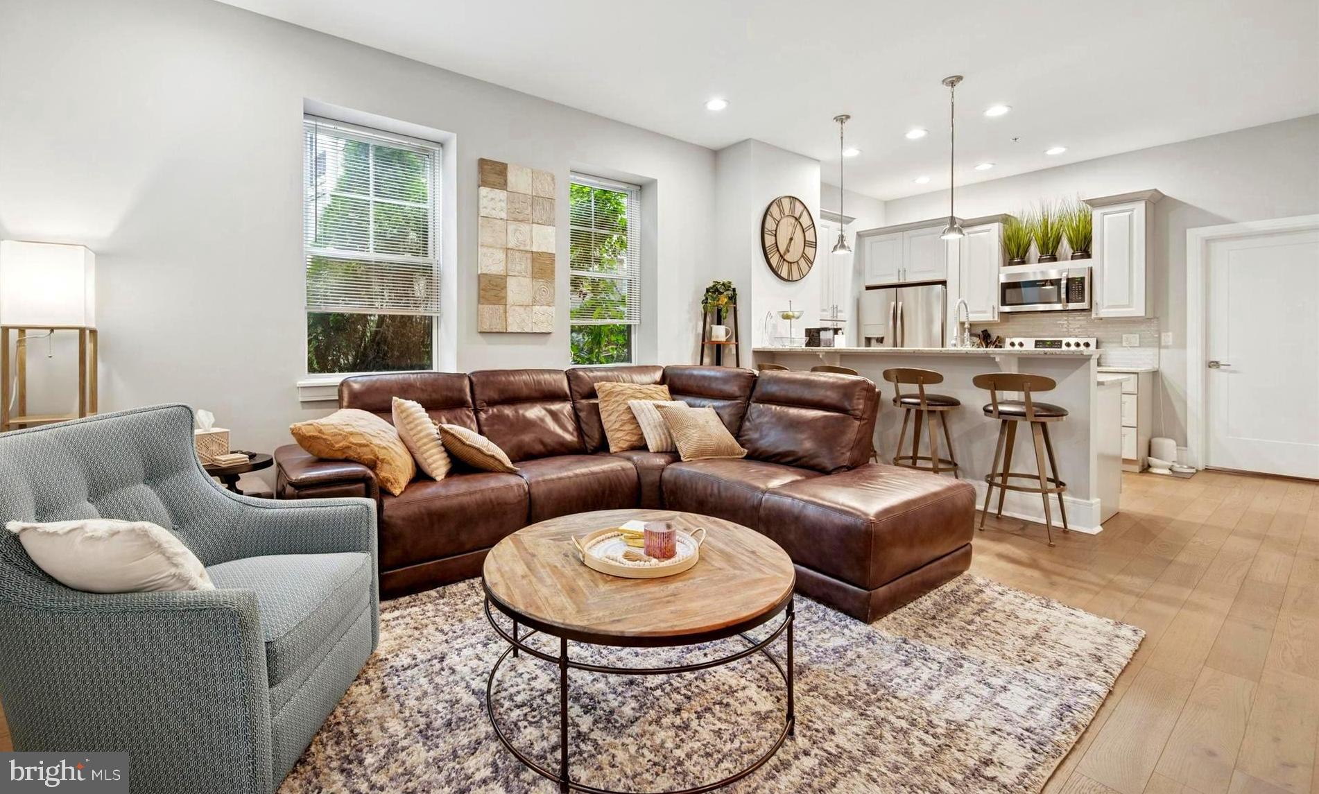 Available Nov 1st! This stunning, first-floor 2-bedroom, 2-full bathroom residence showcases 9'–10' ceiling heights, oversized windows that flood the home with natural light, and thoughtful details throughout. Inside, you’ll find hardwood floors, high-end finishes, and custom millwork that elevate every space. The gourmet kitchen features granite countertops, stainless steel appliances, and ample cabinet storage with a floor to ceiling cabinet pantry. The open layout starts with the living area with plenty of room for a dining area or keep it a great room with a breakfast bar seating on the kitchen peninsula. Walk down the hall to the left to find the primary bedroom suite with sliding doors and Juliette balcony—perfect for enjoying fresh air. The walk-in closet is a dream with plenty of space for hanging clothes and dressers, shelves and shoes. The ensuite primary bathroom is beautifully appointed with a walk-in shower with glass surround.
On the other side of the condo, is the 2nd bedroom suite, complete with private entrance to the 2nd bathroom that also has another entrance to the main living area. A full-sized washer/dryer is stacked conveniently in the hall laundry closet, across from a large storage closet with easy access to all of your mechnicals. Need even more storage? You have elevator access to a basement storage cage where you can store your belongings all the way to the ceiling.
Two deeded assigned parking spaces (worth $15,000 each for a total of $30k in extra amenities) are included in the sale for your convenience. There are also several guest parking spots available as well as plenty of street parking for visitors.
Living at AppleMoore Condominiums means enjoying a worry-free lifestyle—your condo fee includes common area maintenance, all exterior building maintenance, landscaping and video security features, snow removal, trash, and water. Easy access on the first floor means no elevator or stairs to climb when you need to walk the dog or go for an early morning run!
The location can’t be beat—enjoy walks to nearby parks like McKenzie Park and the Schuylkill River Trail for outdoor recreation. Walk to Conshohocken’s vibrant dining and nightlife just steps away, with favorites like Gypsy Restaurant, Salt & Stone, Nudy’s Café, Boathouse and American Pubs, and Hook & Ladder. Local events like ConshyFest add to the lively community atmosphere. With easy access to major highways such as 476 & 76, easy commuting to Philadelphia, the Main Line, or King of Prussia.
If you’re seeking modern luxury, low-maintenance living, 2+car parking and an unbeatable walkable location in West Conshohocken, this condo is a must-see!