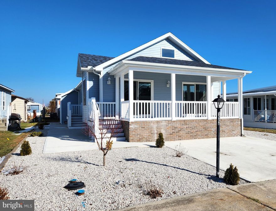 NEW CONSTRUCTION! This custom built home is located in the Montego Bay community in North Ocean City Maryland and is situated approx.  3/4 of a mile from Ocean City's beautiful 10-mile long public beach. It is also within walking distance to the busline, the Montego Bay Shopping Center, many restaurants & bars and the beautiful 58-acre Northside Park. The home features a 10' x 20' front porch with a cement floor & cathedral ceilings, a great room floorplan with the living room, dining room and kitchen in one area, cathedral ceilings-both in the great room & master bedroom, granite countertops, a kitchen island with a granite top, stainless steel high-end appliances, ceramic subway tile backsplash, soft close kitchen cabinets, a laundry room with a full size side by side high-end washer & dryer and a laundry tub, a master bath featuring a walk-in shower with floor to ceiling tile shower walls, ceramic tile shower walls in the guest bath, a sprinkler system, crown & baseboard moldings, luxury vinyl plank flooring throughout, 2 x 6 wall construction, 4 ceiling fans with lights, a floored attic, a bump out in the living room for a future gas fireplace, a window seat in the dining room and extra large windows along with two patio doors in the living area providing an abundance of natural light. The outside features a landscaped lot-with no grass to cut, a large cement patio, a 5' x 10' custom-built storage shed with high ceilings & a painted drywall interior and a new 2-car cement parking pad. The community features 3 pools, including a kiddie pool for the little ones, 2 tennis courts, a pickleball court, a 9-hole miniature golf course, a shuffleboard court, a bayfront boardwalk with 3 fishing piers, a canalfront fishing & crabbing area, an 8-acre wildlife sanctuary/pond with a 1/2 mile paved walking path, a 5-acre open park and street lighting with a lamppost at every residence. Additional amenities include city streets & sidewalks, city water & sewer and city trash collection. The HOA fees are just $396 a year!
Taxes are approximate.