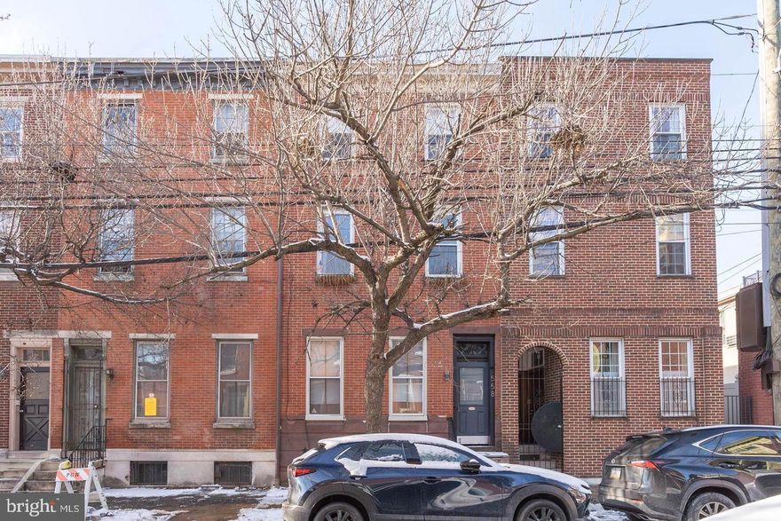 Offering an unbeatable Spring Garden location steps from dining and shopping, 558 N 16th St #3 is a 2 bed, 1.5 bath condo with a private balcony, sat on the top two levels of a triplex. The building greets you out front with a classic red brick facade. Inside the unit, soaring ceilings and luxury flooring frame the bright and airy living room. A pair of towering windows, intricate molding, and a fireplace add character to the space, plus there's room for a dining area. Completing the main level is a kitchen with a dishwasher and a storage closet off the entry. The unit's second level is split, allowing for privacy in each of the bedrooms. Off the stairs is a bright bedroom and a modern full bathroom with distinctive tile floors, a glass-enclosed shower, and brass-toned fixtures. Past the conveniently placed laundry closet is a large, sunlit primary suite boasting a vaulted ceiling, a walk-in closet, and a half-bathroom. Topping off the unit is a serene balcony, perfect for barbecues or relaxing with a good book. In addition to everything inside, this fantastic location earns a Walk Score of 94! Around the corner, Spring Garden St and Broad St are lined with restaurants, stores, gyms, and markets. Sprawling parks are steps away, plus colleges and museums are close. There's also easy access to public transit, I-676, and I-76. Schedule your tour today!