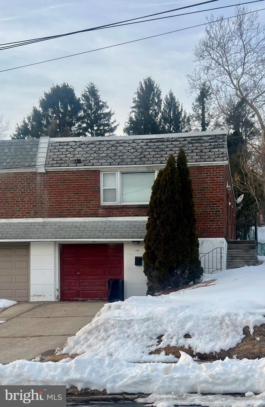 This charming hillside ranch offers 3 bedrooms and 1.5 bathrooms with an attached garage and is ideally located in the heart of Roxborough.

The street-level entry provides direct access to the attached garage and a spacious lower level. This level features a generous laundry room with exterior access, a convenient half bath, and flexible space ideal for a home office, gym, or guest area. The large family room includes a fireplace and interior stairs leading to the main level. A rear door opens directly to the private backyard, offering easy indoor-outdoor living.

The main living area can also be accessed via exterior stairs along the side of the home, leading to the front entrance. Upstairs, you'll find a bright and inviting living room that flows seamlessly into the dining area and spacious kitchen with ample cabinet and counter space. Three comfortable bedrooms and a full hallway bathroom complete this level.

This home offers excellent space and functionality, along with a wonderful opportunity to update and add your personal touch. Bring your vision and unlock its full potential!